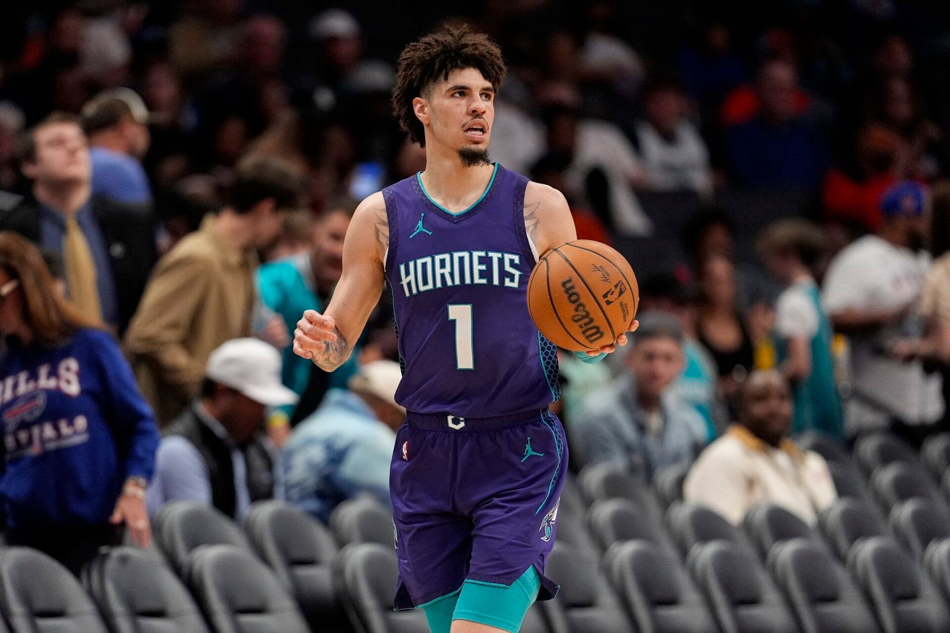 Charlotte Hornets guard LaMelo Ball (1) brings the ball up court against the New York Knicks during the second half at Spectrum Center.