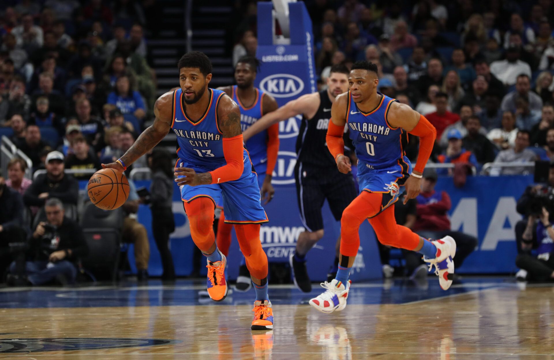 Oklahoma City Thunder forward Paul George (13) drives to the basket as Oklahoma City Thunder guard Russell Westbrook (0)t runs during the second quarter at Amway Center.