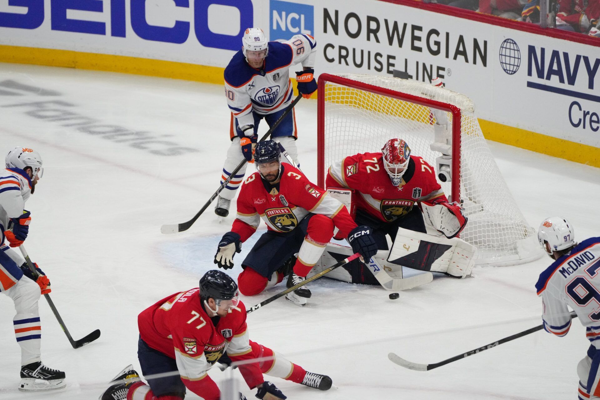 Florida Panthers goaltender Sergei Bobrovsky (72) and defenseman Seth Jones (3) defend against Edmonton Oilers center Connor McDavid (97) during the first period in game three of the 2025 Stanley Cup Final at Amerant Bank Arena.