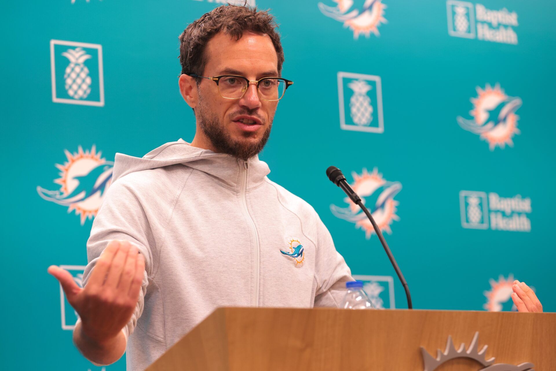 Miami Dolphins head coach Mike McDaniel talks to reporters before practice during mandatory minicamp at Hard Rock Stadium.