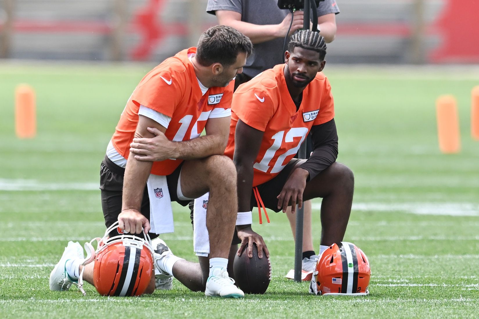 Cleveland Browns quarterback Joe Flacco (15) talks to quarterback Shedeur Sanders (12) during minicamp at CrossCountry Mortgage Campus.