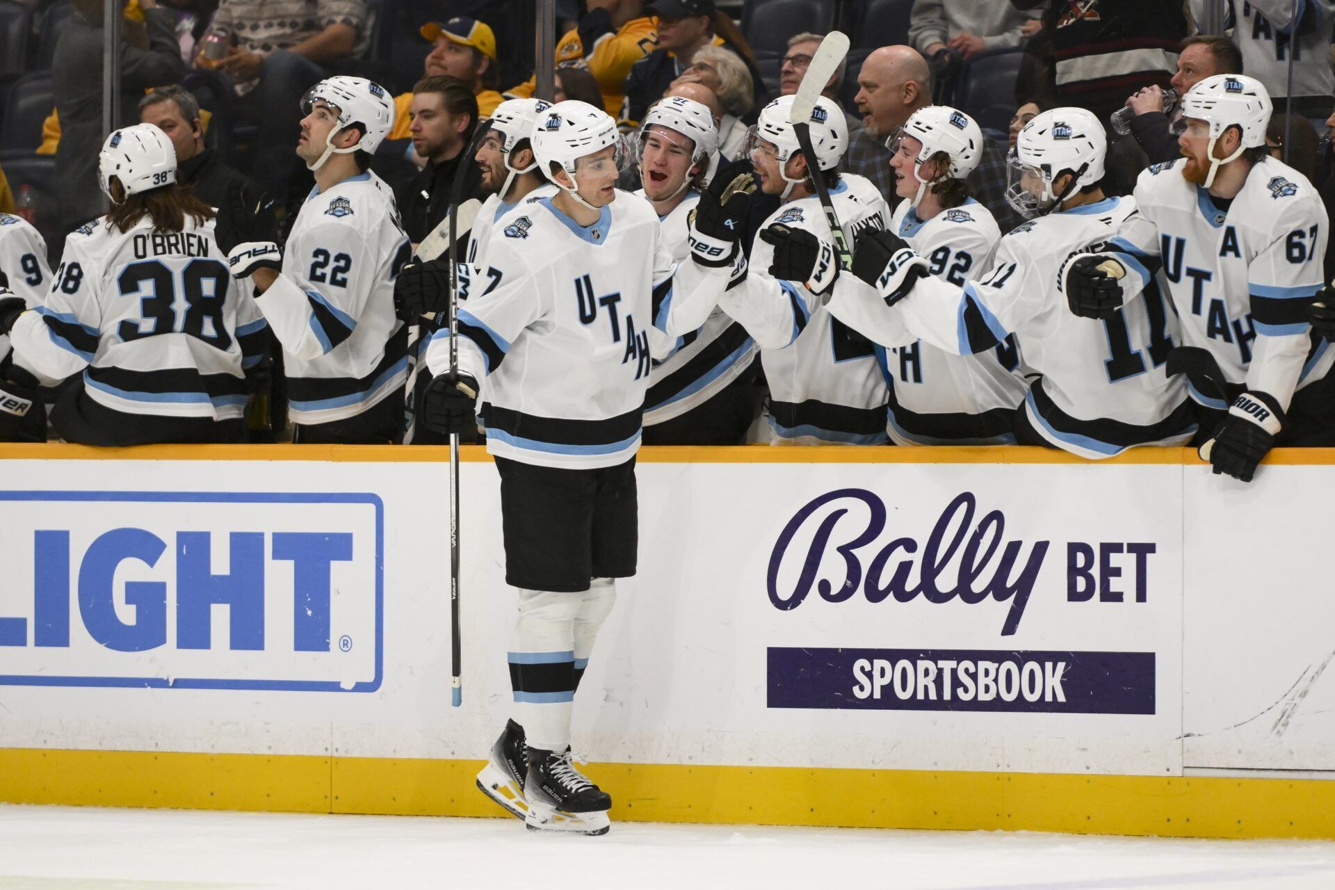 Utah Hockey Club defenseman Michael Kesselring (7) celebrates his goal with his teammates  against the Nashville Predators during the first period at Bridgestone Arena.
