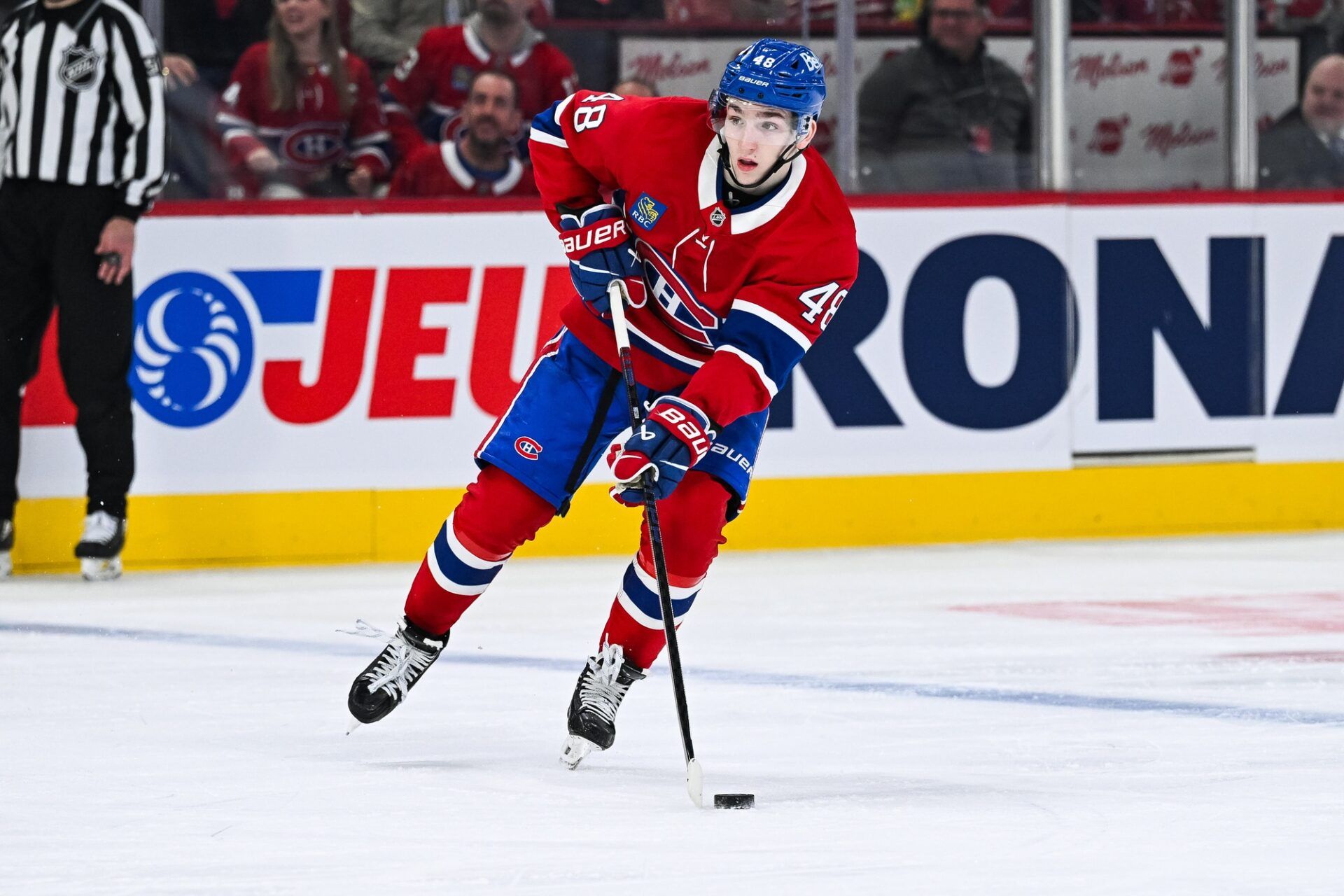 Montreal Canadiens defenseman Lane Hutson (48) plays the puck against the Chicago Blackhawks in the second period at Bell Centre.