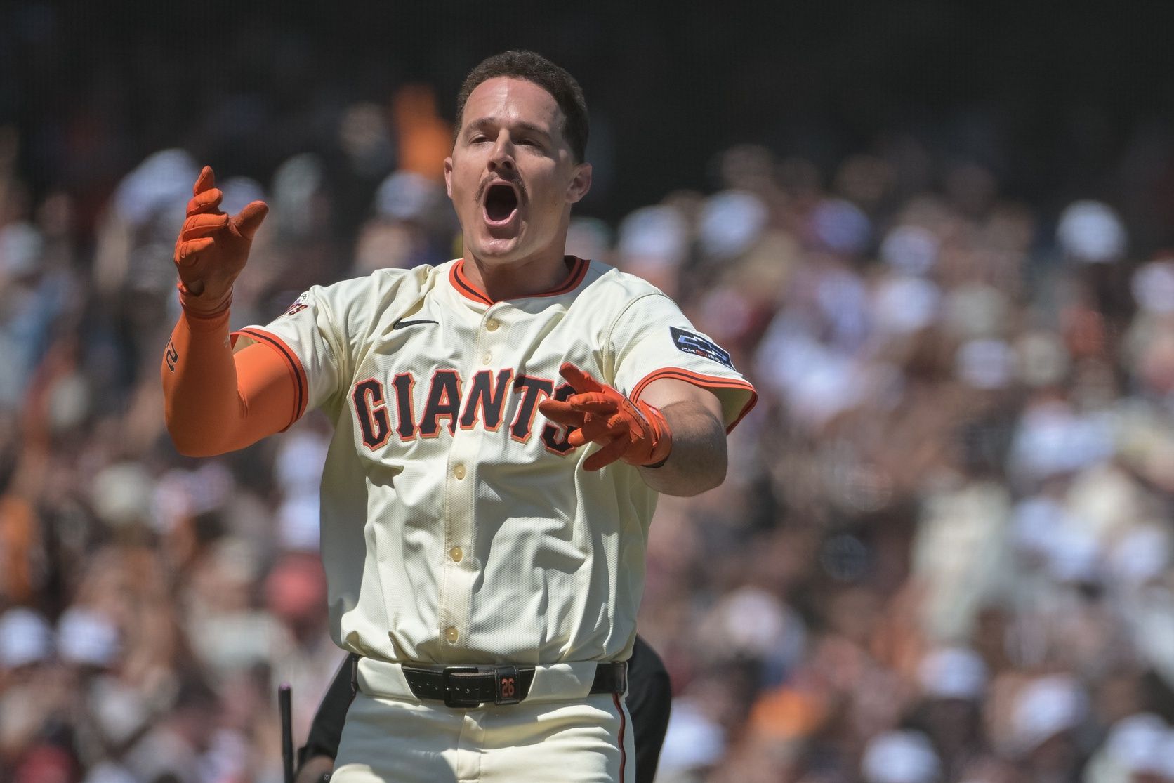San Francisco Giants third baseman Matt Chapman (26) celebrates after hitting a walk off home run against the Atlanta Braves during the ninth inning at Oracle Park.