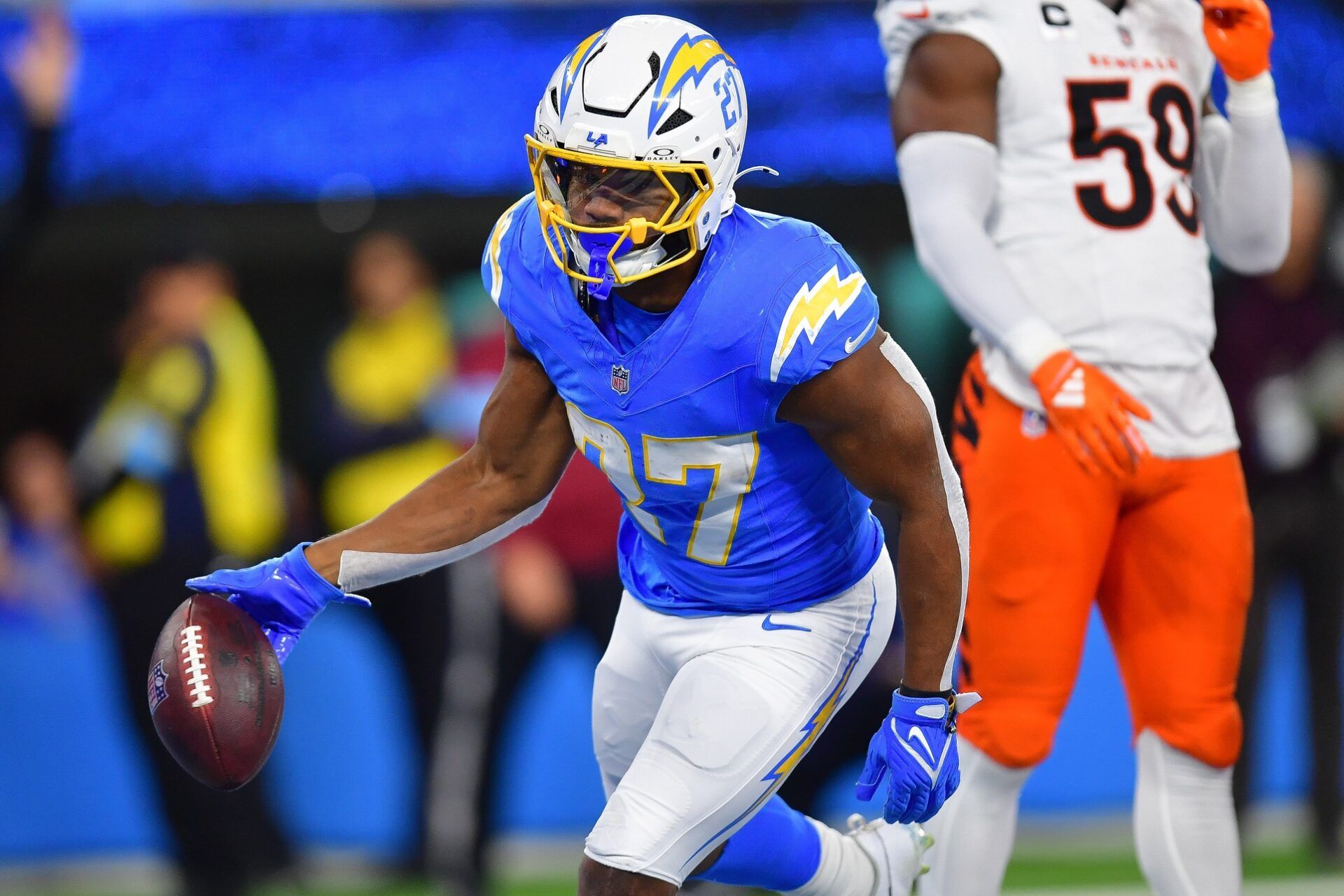 Los Angeles Chargers running back J.K. Dobbins (27) celebrates his touchdown scored against the Cincinnati Bengals during the first half at SoFi Stadium.