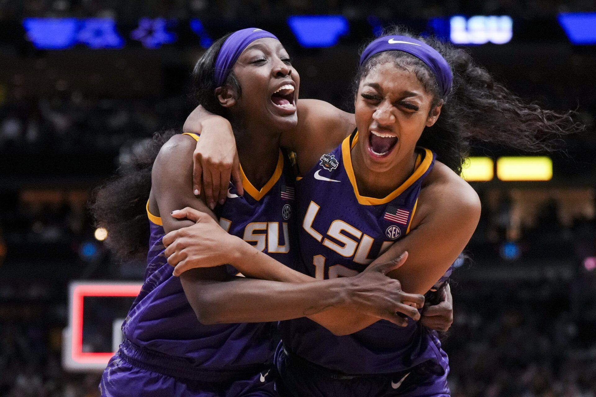 LSU Lady Tigers guard Flau'jae Johnson, left, celebrates with forward Angel Reese after defeating the Virginia Tech Hokies in semifinals of the women's Final Four of the 2023 NCAA Tournament at American Airlines Center.