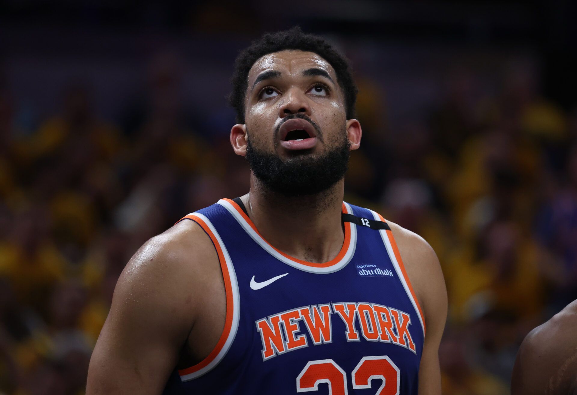 New York Knicks center Karl-Anthony Towns (32) looks up at a scoreboard during the third quarter against the Indiana Pacers of game four of the eastern conference finals for the 2025 NBA Playoffs at Gainbridge Fieldhouse.