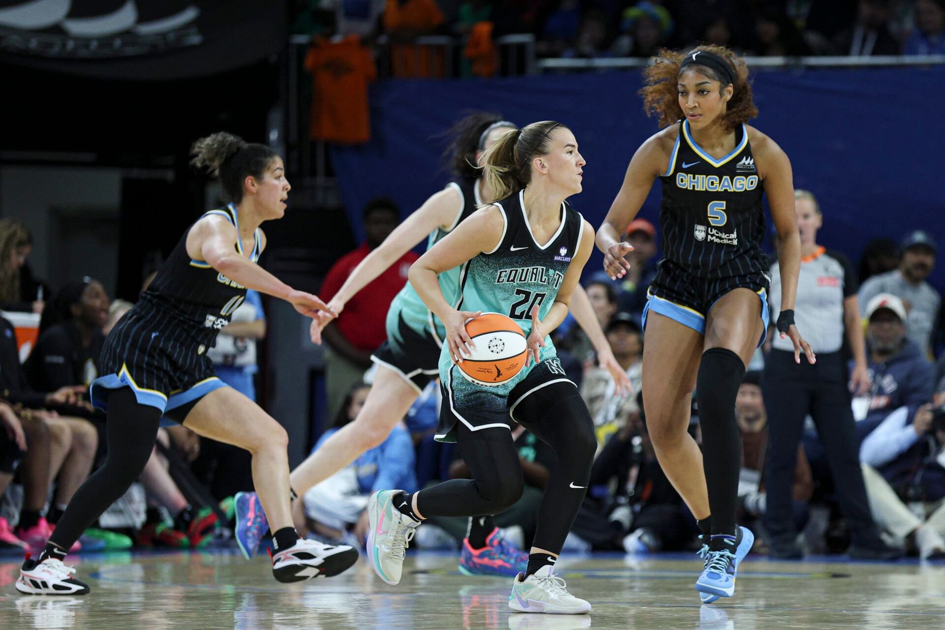 Chicago Sky forward Angel Reese (5) defends against New York Liberty guard Sabrina Ionescu (20) during the second half at Wintrust Arena.