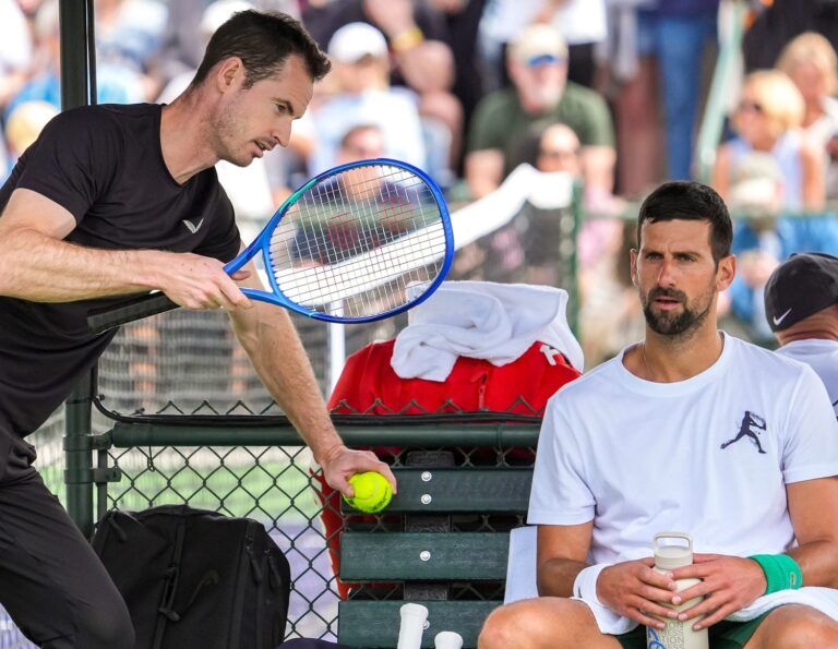 Andy Murray (left) chats with Novak Djokovic as he takes a break from his practice session at the Indian Wells Tennis Garden in Indian Wells, Calif., Wednesday, March 5, 2025.