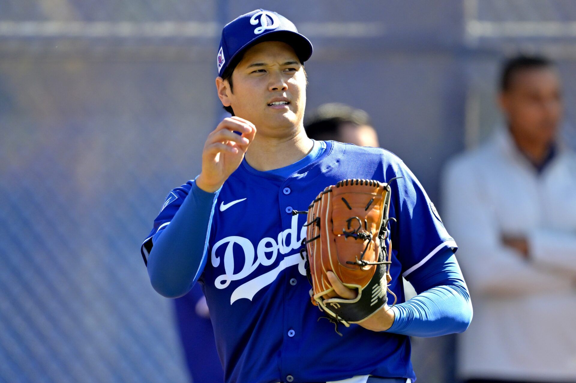 Los Angeles Dodgers designated hitter Shohei Ohtani (17) throws a bullpen session during spring training workouts at Camelback Ranch.