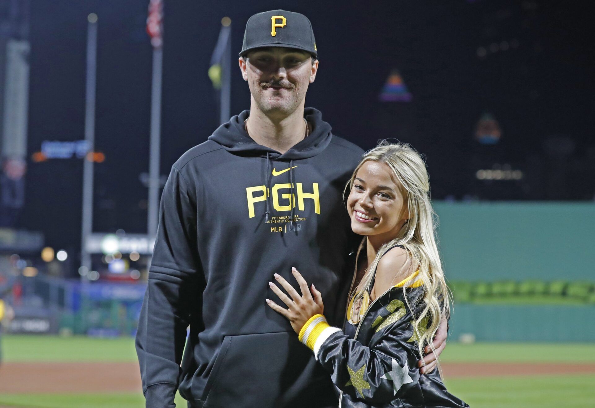 Pittsburgh Pirates starting pitcher Paul Skenes (30) poses with his girlfriend Louisiana State University gymnast Olivia Dunn (right) after making his major league debut against the Chicago Cubs at PNC Park. The Pirates won 10-8.