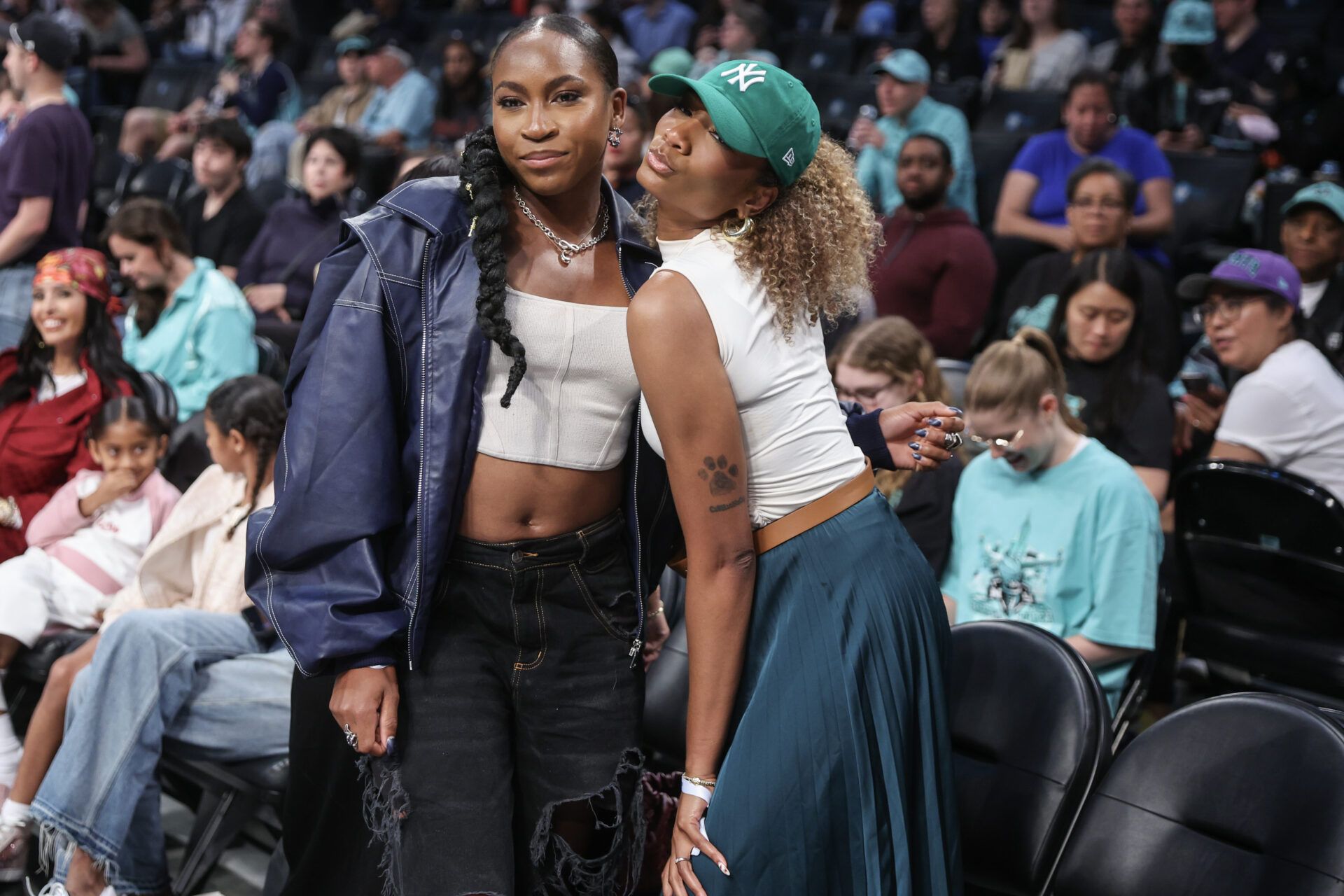 Professional tennis player Coco Gauff (l) and journalist Arielle Chambers (r) prior to the game between the Chicago Sky and the New York Liberty at Barclays Center.