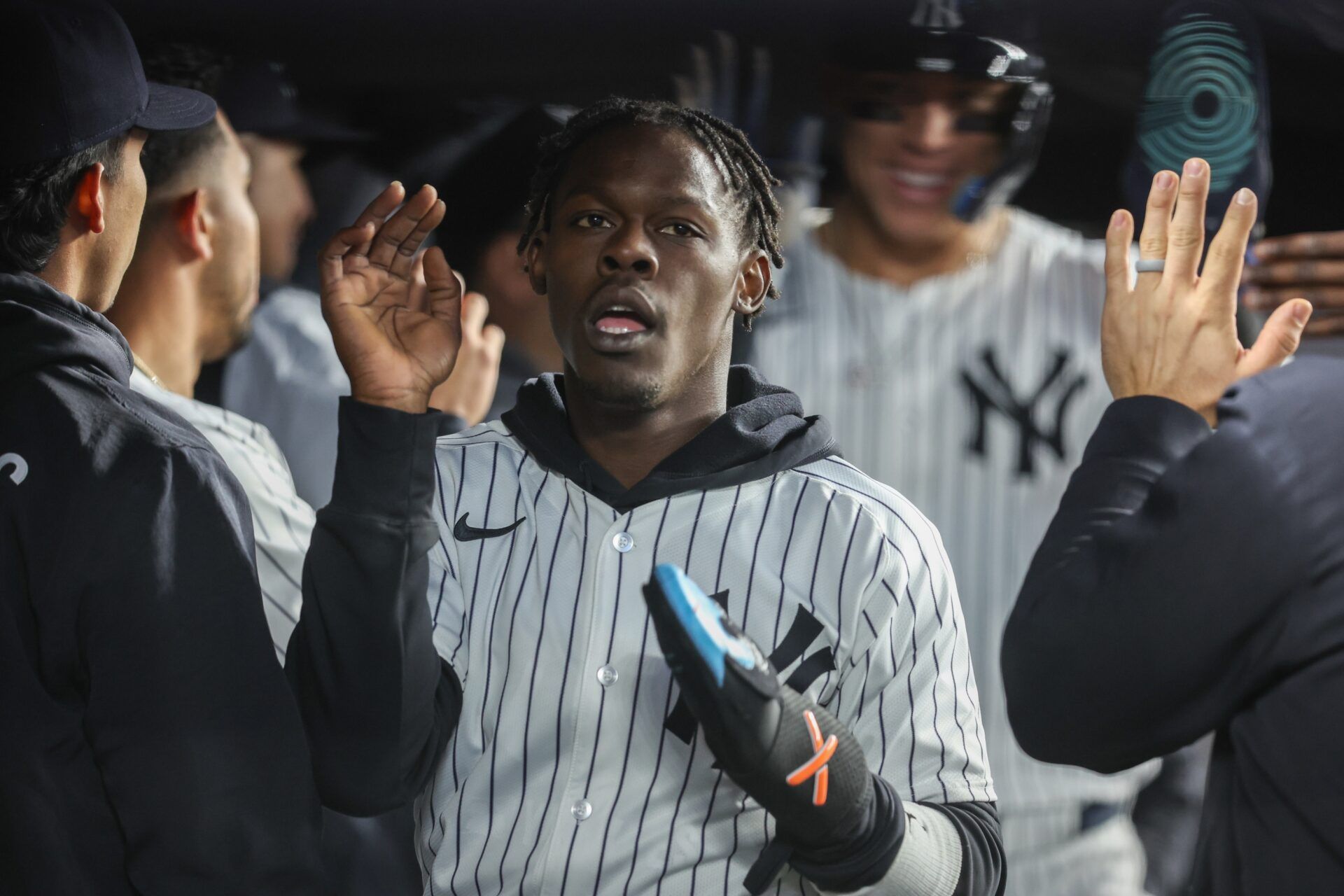 New York Yankees second baseman Jazz Chisholm Jr.  is greeted in the dugout after scoring in the third inning against the Kansas City Royals at Yankee Stadium.
