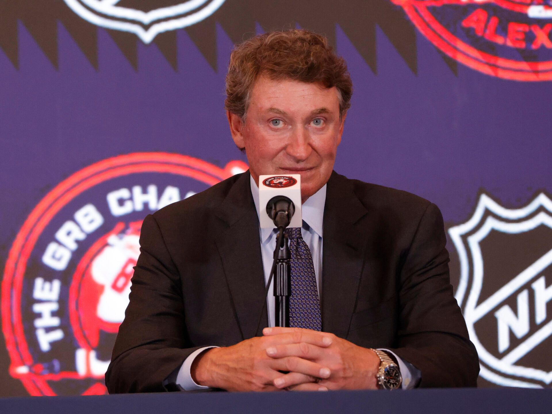 Wayne Gretzky speaks during a press conference with Washington Capitals left wing Alex Ovechkin (not pictured) after the game against the Chicago Blackhawks at Capital One Arena. Ovechkin scored the 893rd and 894th goals of his career, tying Gretzky for most all-time goals in NHL history at Capital One Arena.