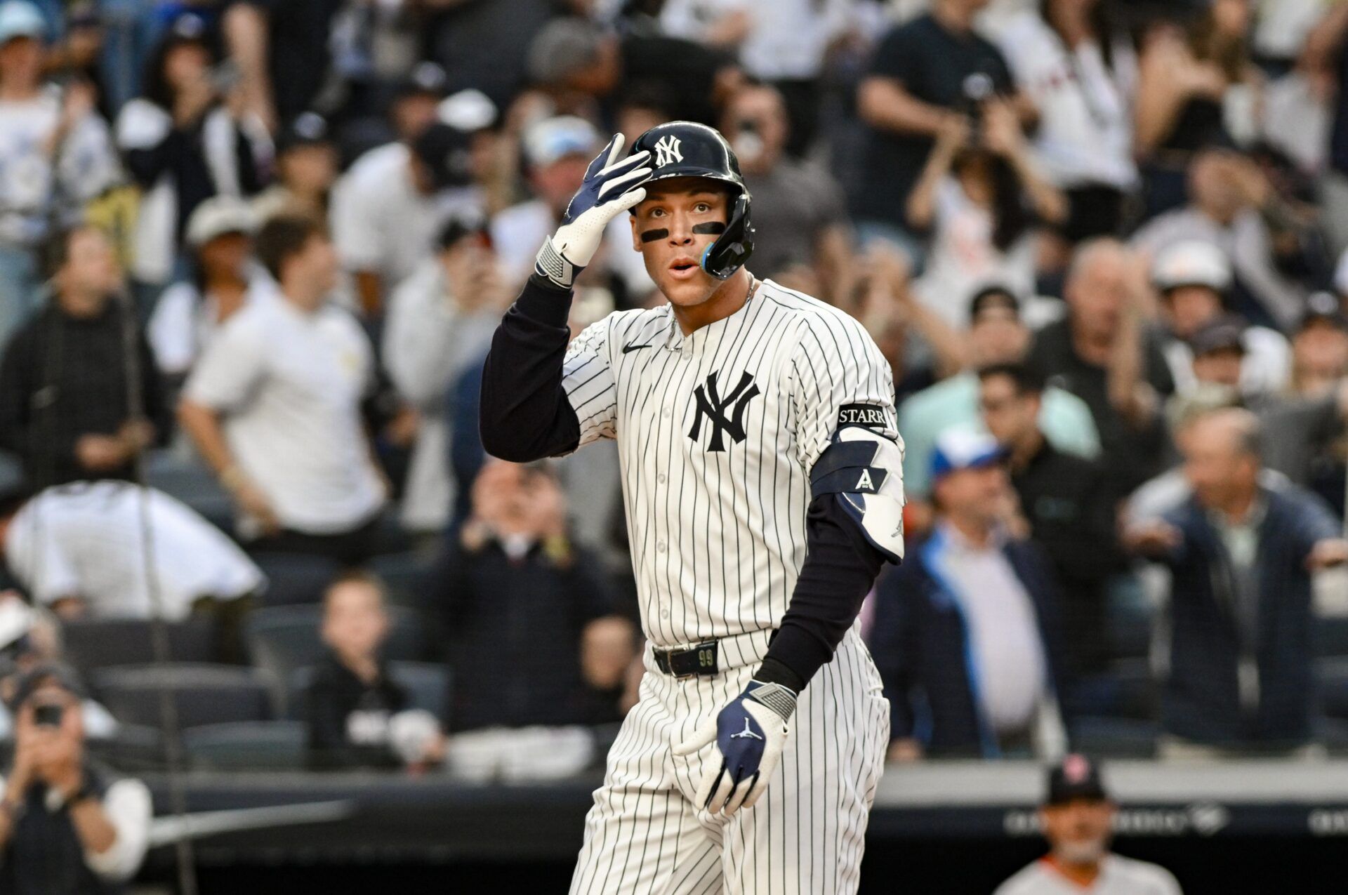 New York Yankees outfielder Aaron Judge (99) reacts after hitting a two-run home run against the Boston red Sox during the first inning at Yankee Stadium.