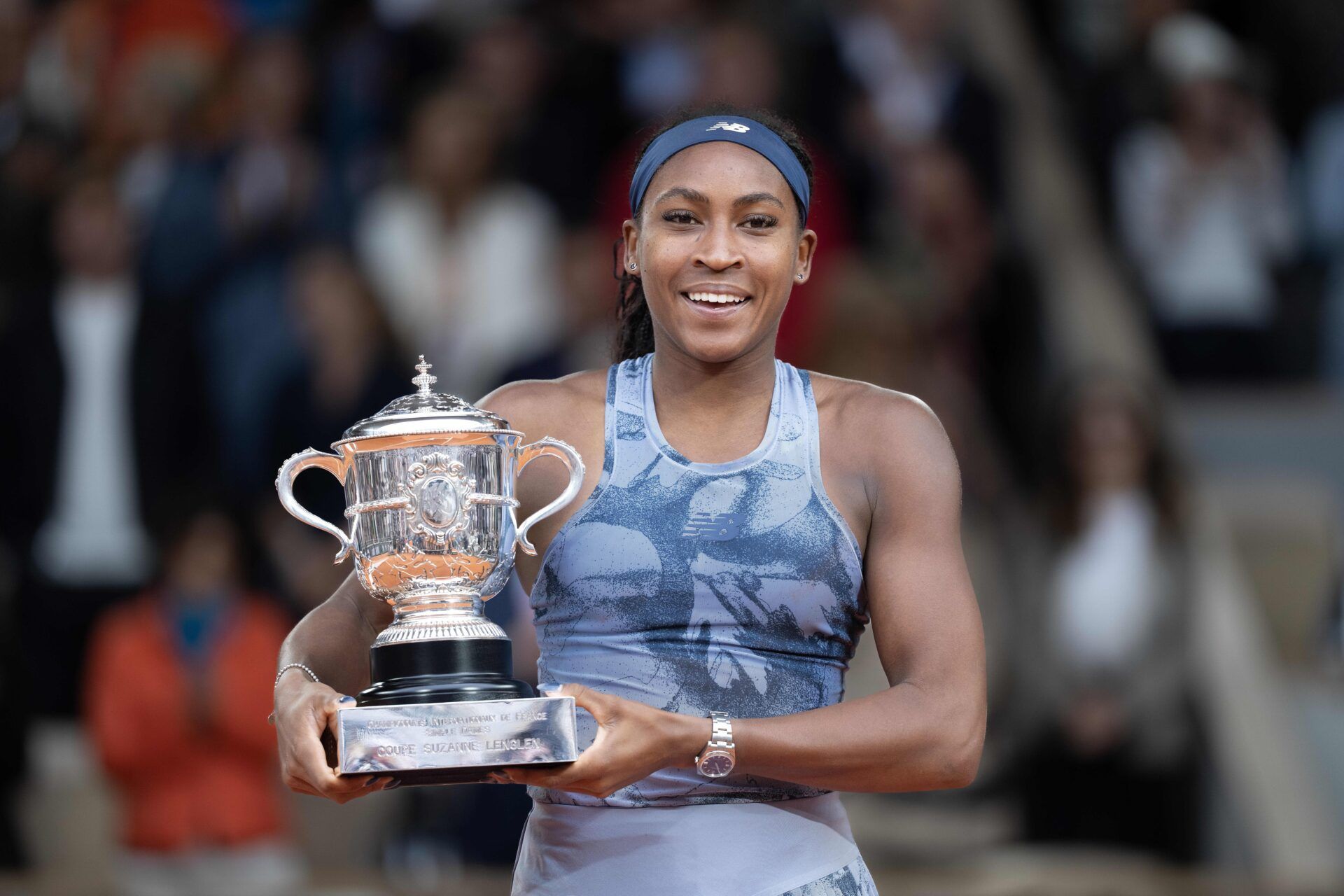 Coco Gauff of the United States poses with the trophy after winning the womens singles final against Aryna Sabalenka on day 14 at Roland Garros Stadium.