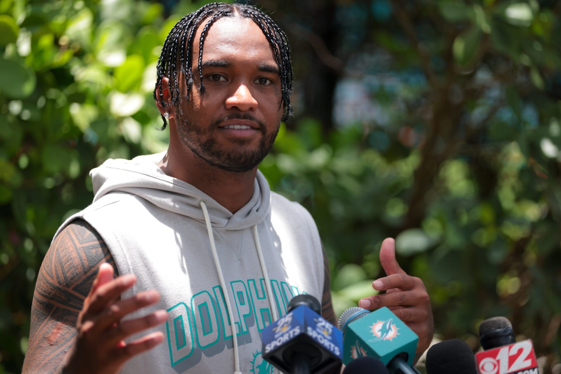 Miami Dolphins quarterback Tua Tagovailoa (1) speaks to reporters after practicing during mandatory minicamp at Hard Rock Stadium.