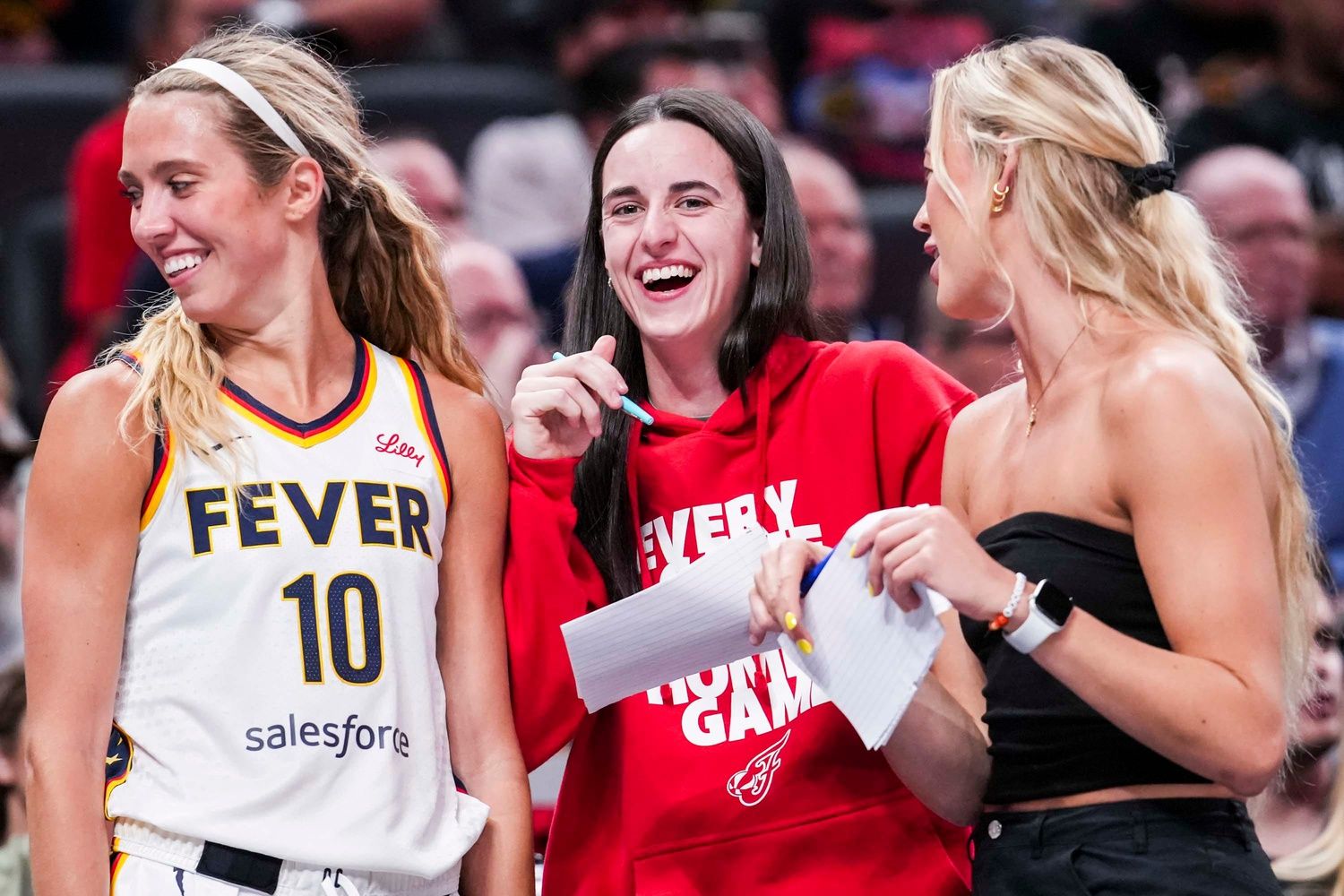 Indiana Fever guard Lexie Hull (10), Indiana Fever guard Caitlin Clark (22), and Indiana Fever guard Sophie Cunningham (8) laugh near the team bench Tuesday, June 3, 2025, during a game between the Indiana Fever and the Washington Mystics at Gainbridge Fieldhouse in Indianapolis.