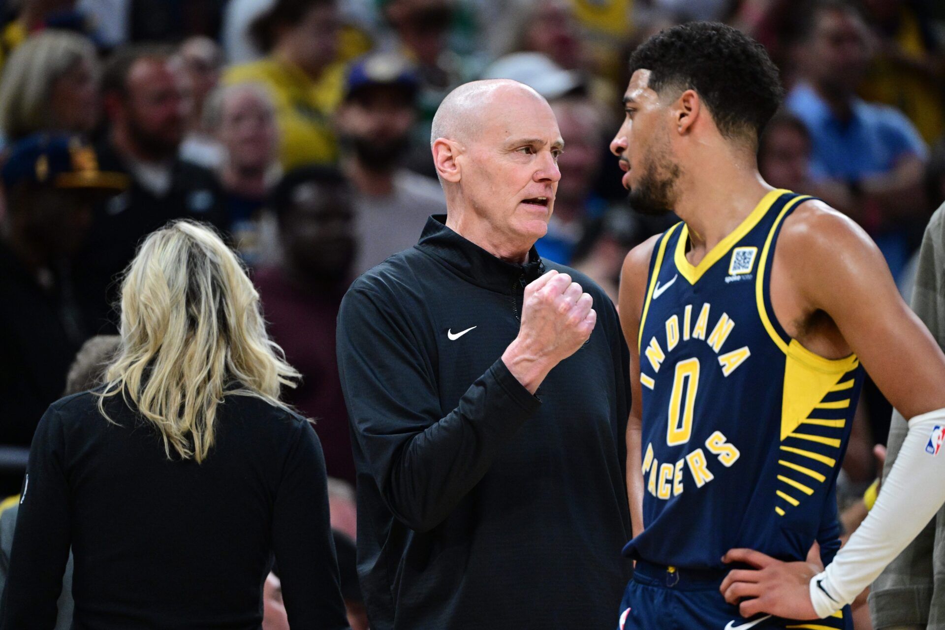 Indiana Pacers Head Coach Rick Carlisle shares a moment with Indiana Pacers guard Tyrese Haliburton (0) during overtime at Gainbridge Fieldhouse.