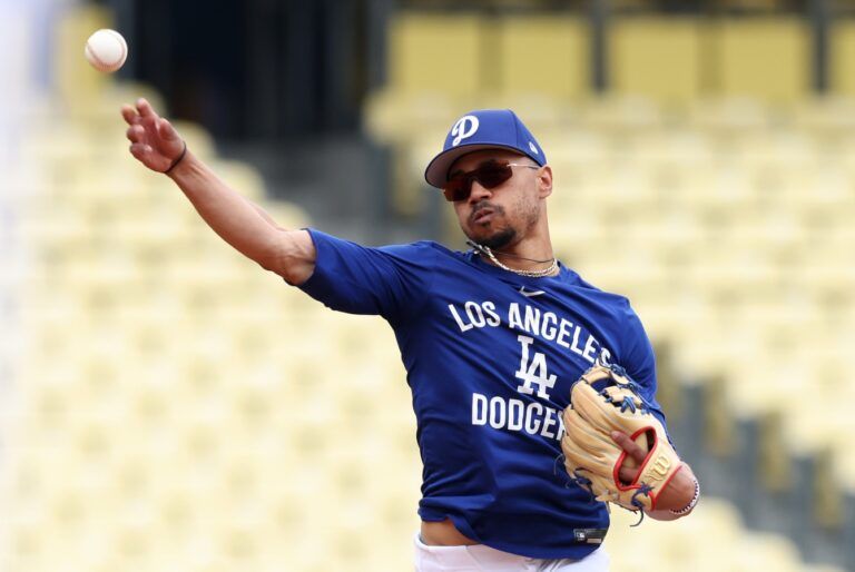 Los Angeles Dodgers shortstop Mookie Betts (50) warms up before a game against the New York Mets at Dodger Stadium.