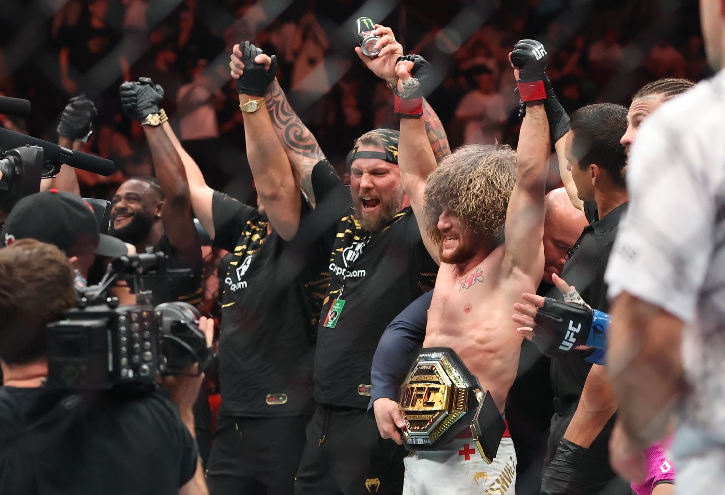 Merab Dvalishvili (red gloves) reacts after defeating Sean O’Malley (not pictured) in a bantamweight title fight during UFC 316 at Prudential Center.