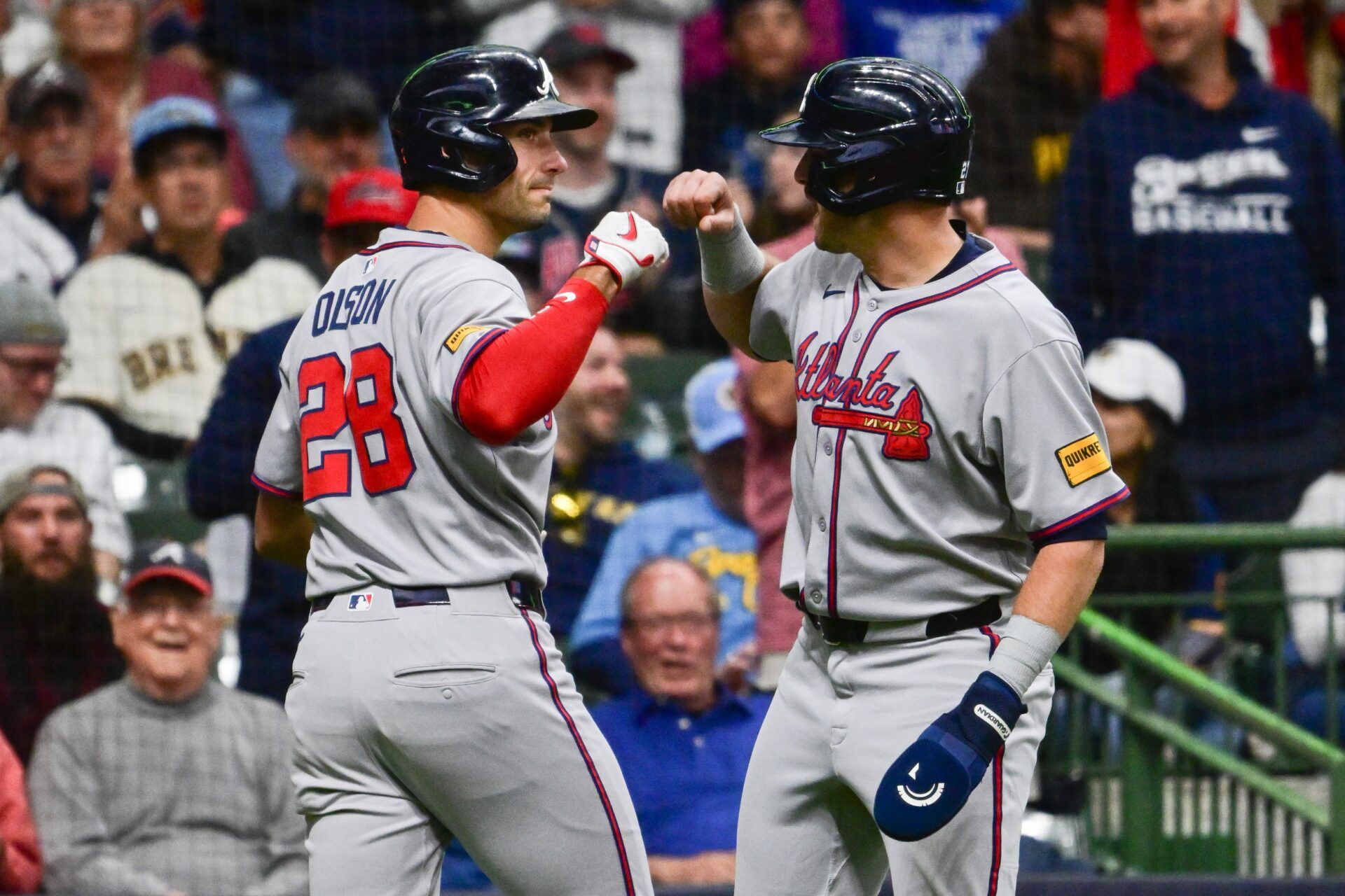 Atlanta Braves first baseman Matt Olson (28) celebrates with third baseman Austin Riley (27) after hitting a 2-run home run in the fifth inning against the Milwaukee Brewers at American Family Field.