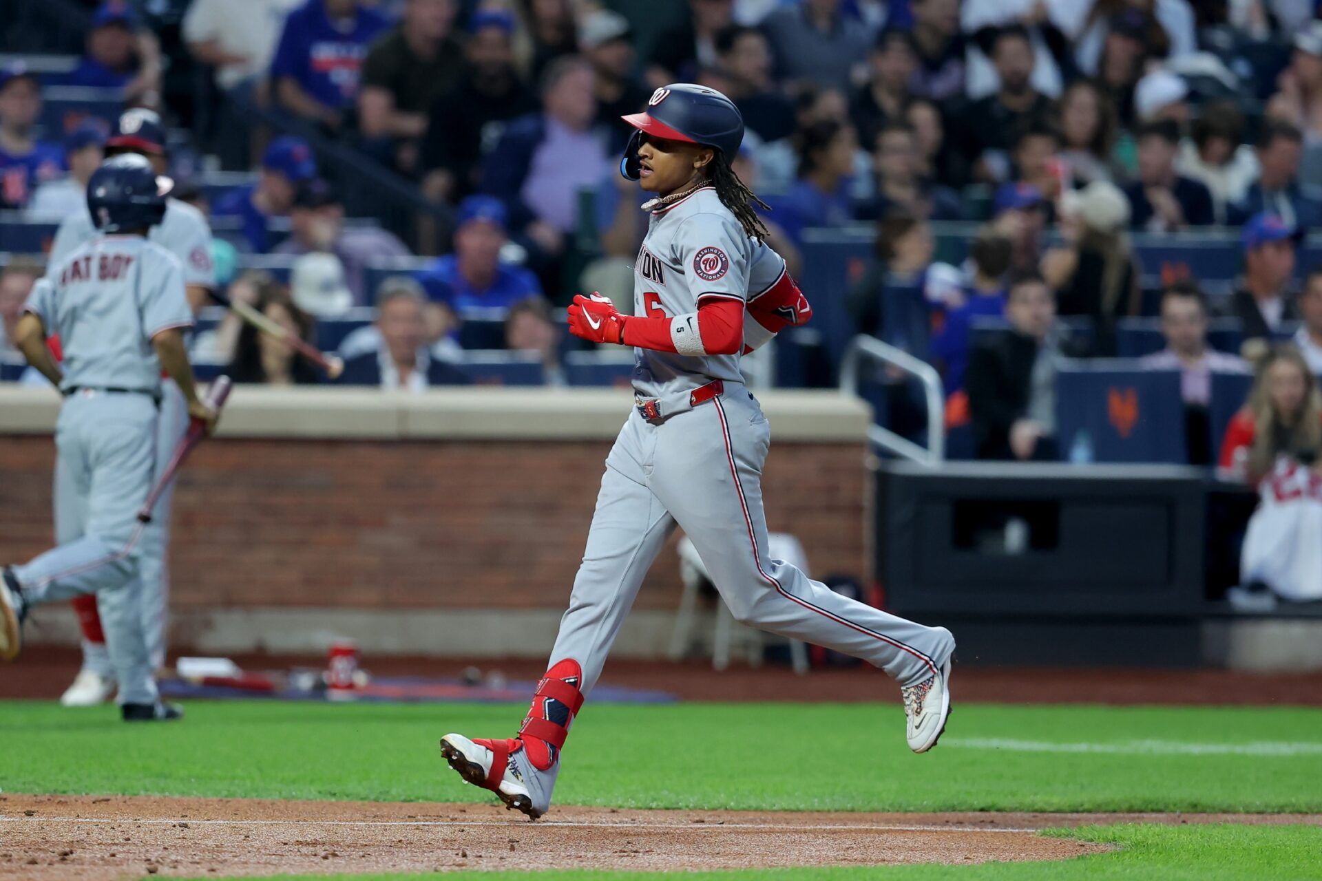 Washington Nationals shortstop CJ Abrams (5) rounds the bases after hitting a solo home run against the New York Mets during the fifth inning at Citi Field.