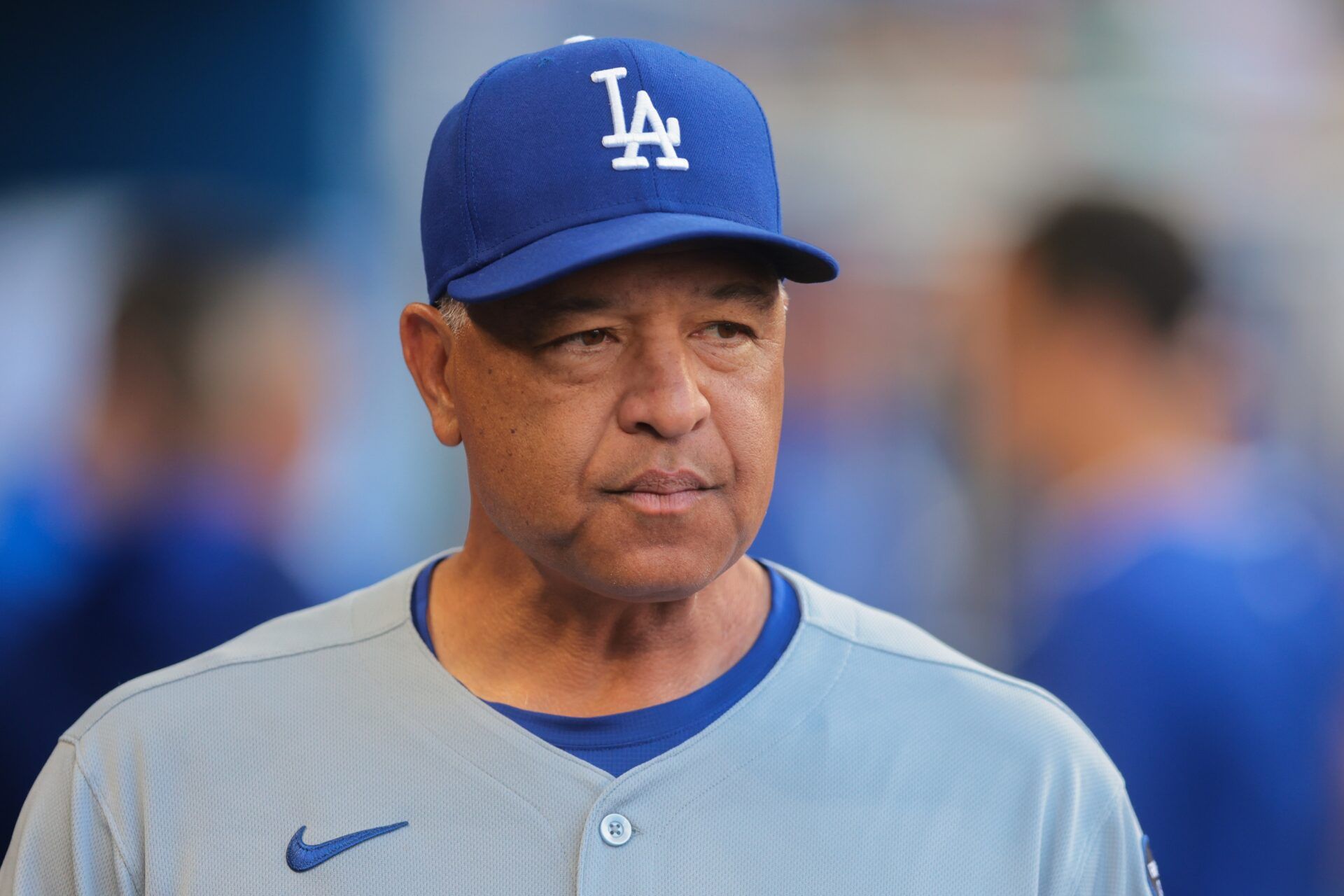 Los Angeles Dodgers manager Dave Roberts (30) looks on from the dugout against the Miami Marlins during the first second at loanDepot Park.