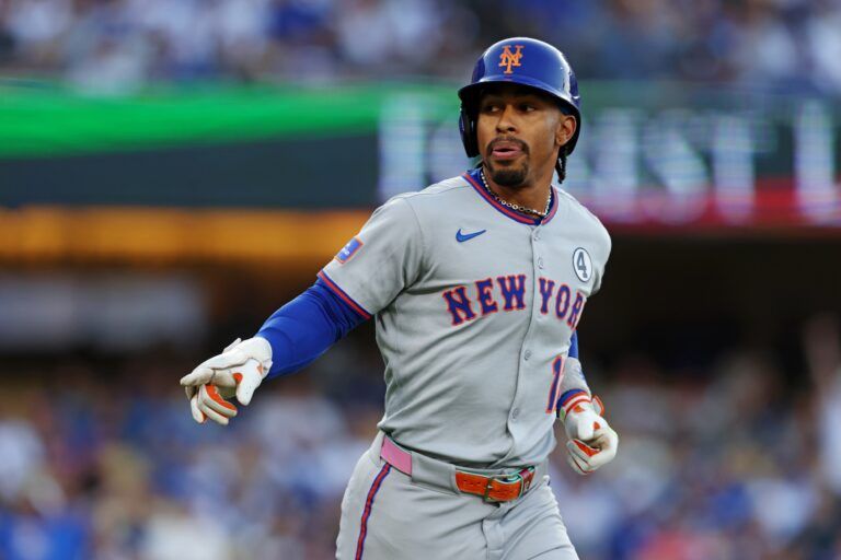 New York Mets shortstop Francisco Lindor (12) rounds the bases during the first inning against the Los Angeles Dodgers during the first inning against the New York Mets at Dodger Stadium.