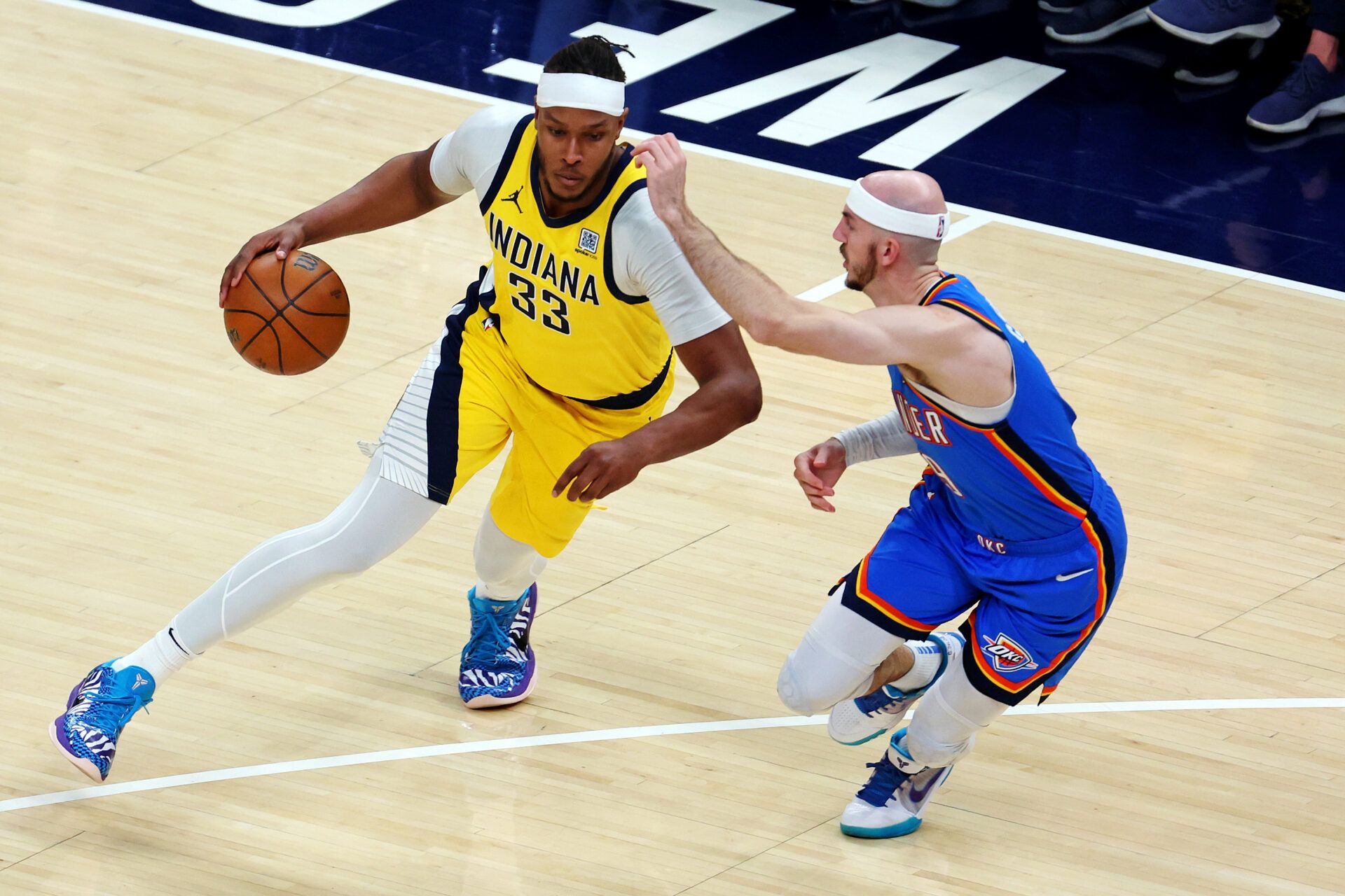 Indiana Pacers center Myles Turner (33) shoots the ball against Oklahoma City Thunder guard Alex Caruso (9) during the first quarter in game three of the 2025 NBA Finals at Gainbridge Fieldhouse.