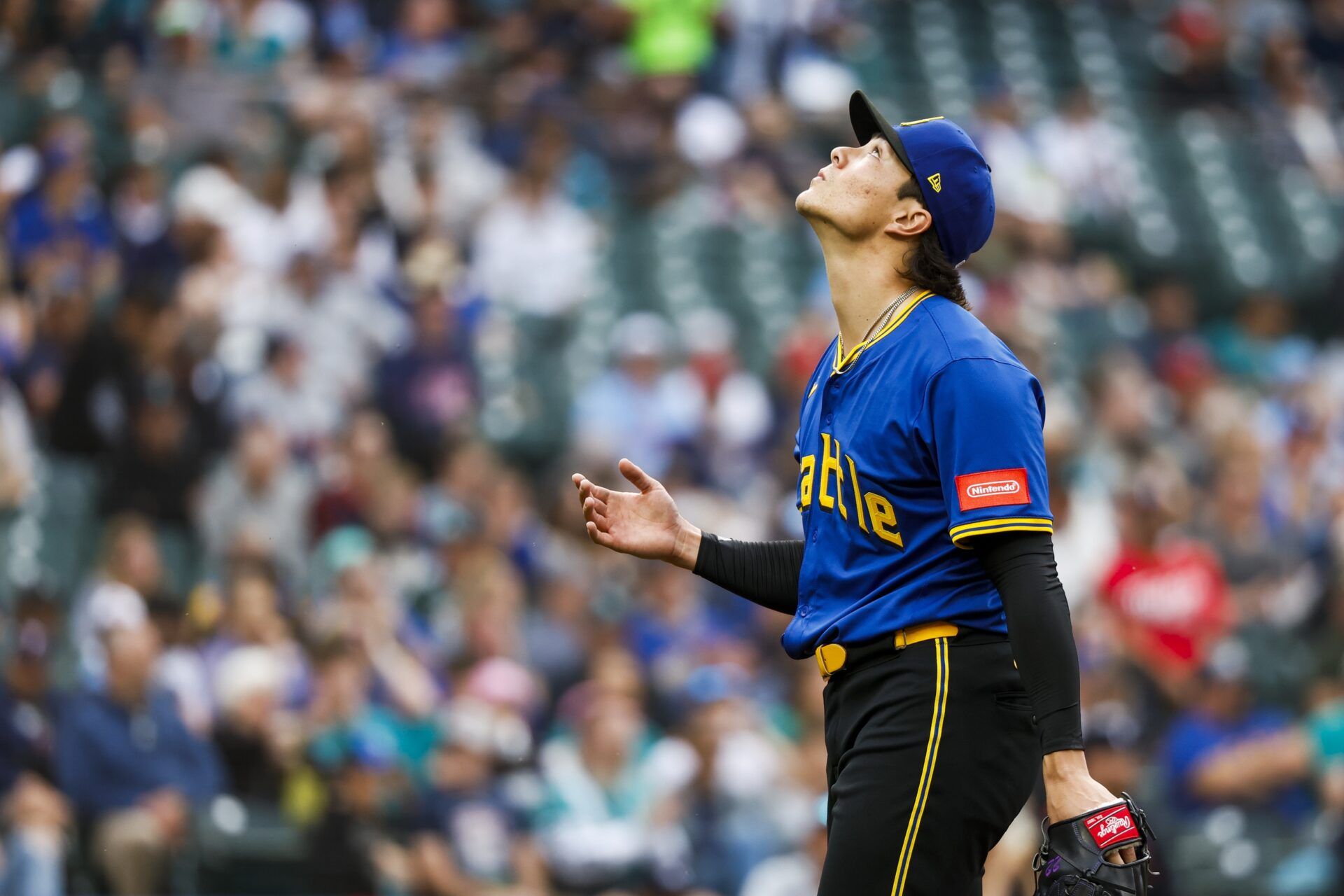 Seattle Mariners starting pitcher Bryan Woo (22) walks to the dugout following the top of the first inning against the Minnesota Twins at T-Mobile Park.