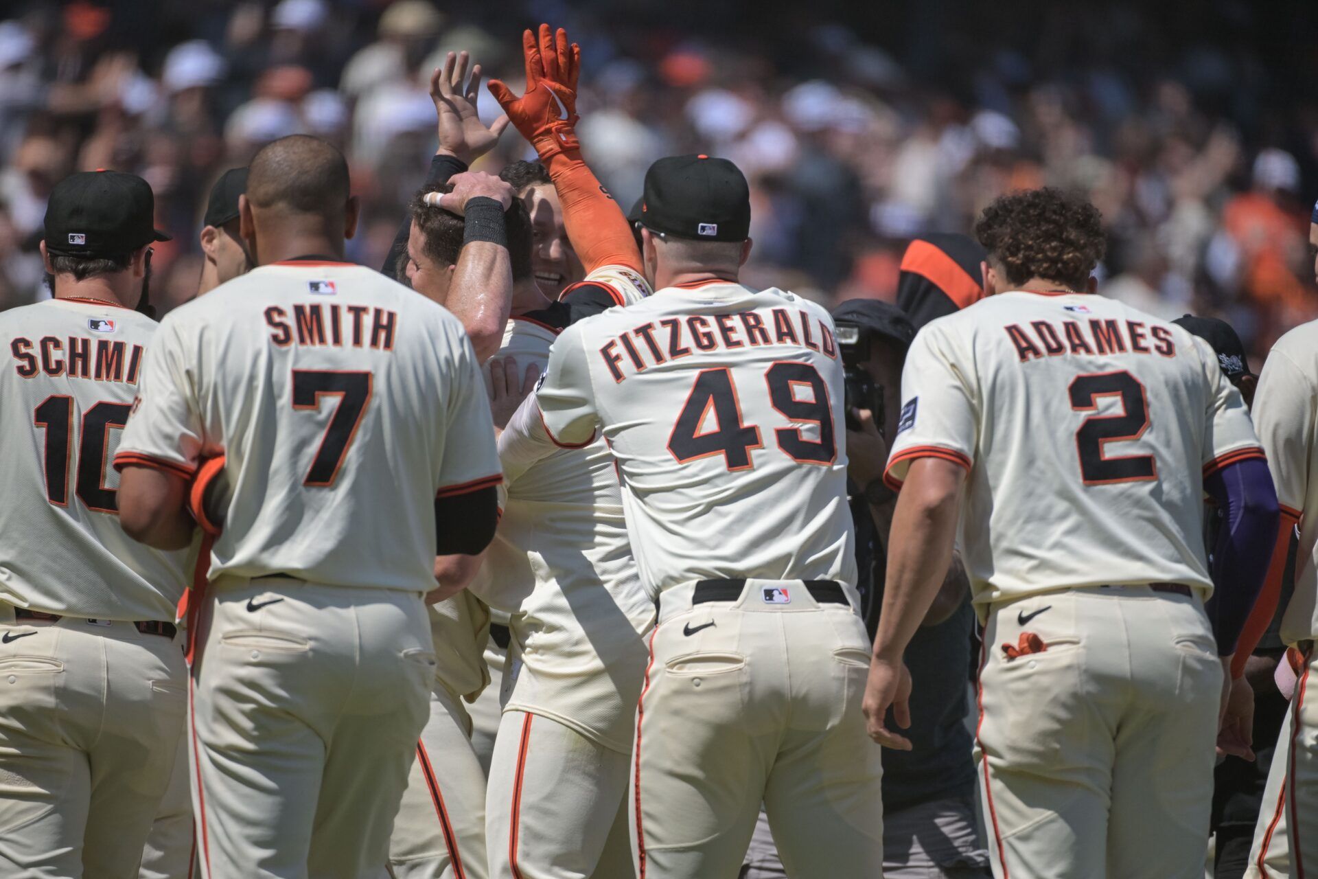 San Francisco Giants third baseman Matt Chapman (26) celebrates with team mates after hitting a walk off home run against the Atlanta Braves during the ninth inning at Oracle Park.