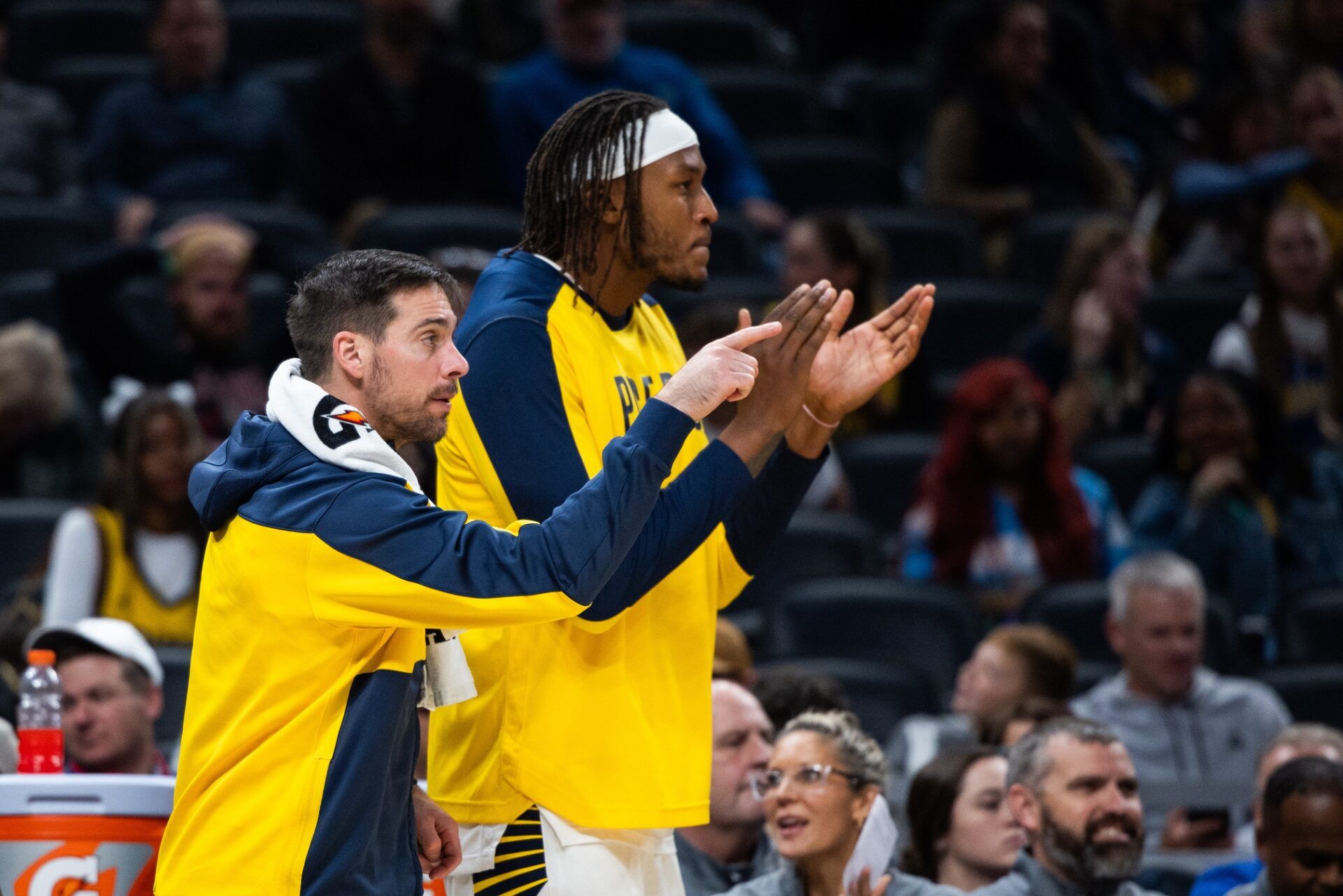 Indiana Pacers guard T.J. McConnell (9) and center Myles Turner (33) cheer from the bench  in the second half against the Charlotte Hornets at Gainbridge Fieldhouse.