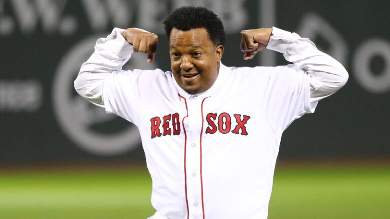 Boston Red Sox former player Pedro Martinez reacts after throwing out the ceremonial first pitch before game two of the 2018 World Series against the Los Angeles Dodgers at Fenway Park.