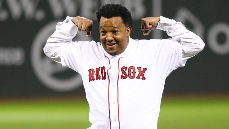 Boston Red Sox former player Pedro Martinez reacts after throwing out the ceremonial first pitch before game two of the 2018 World Series against the Los Angeles Dodgers at Fenway Park.
