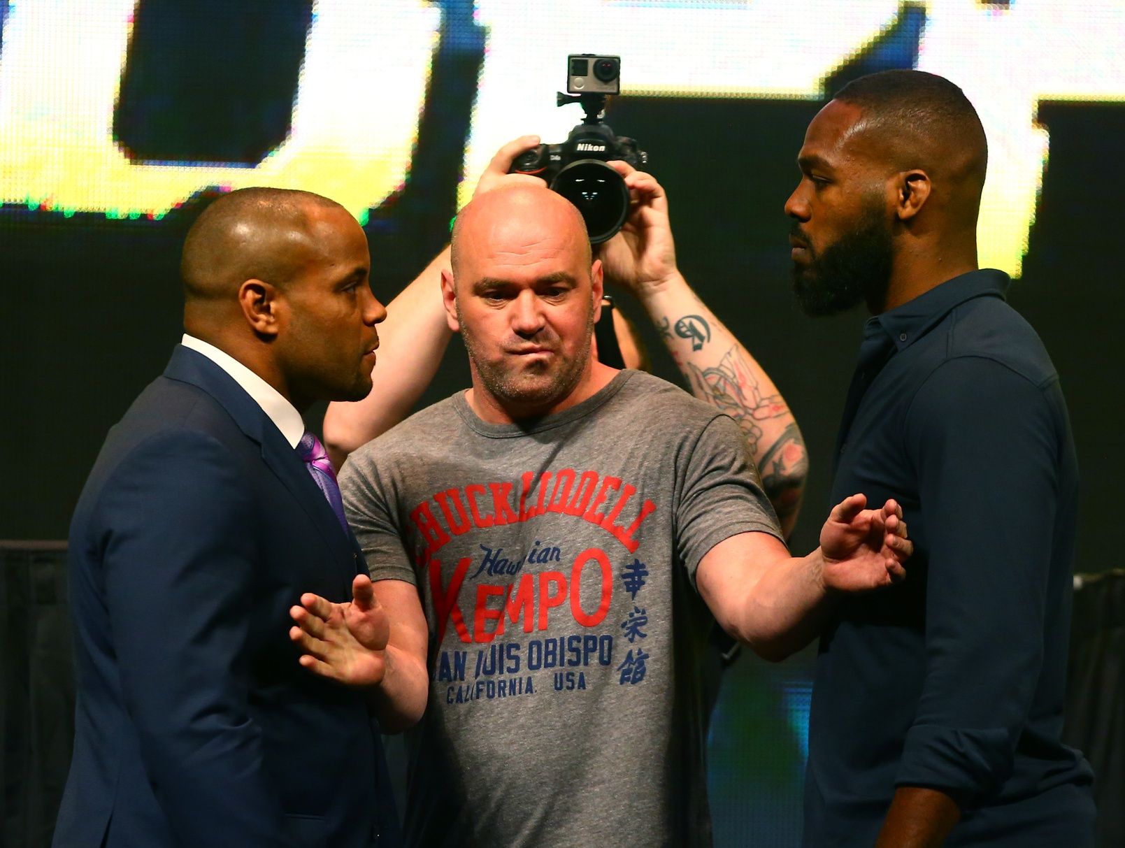 UFC president Dana White (center) separates fighter Jon Jones (right) from Daniel Cormier during a press conference prior to weigh-ins for UFC 196 at MGM Grand Garden Arena.