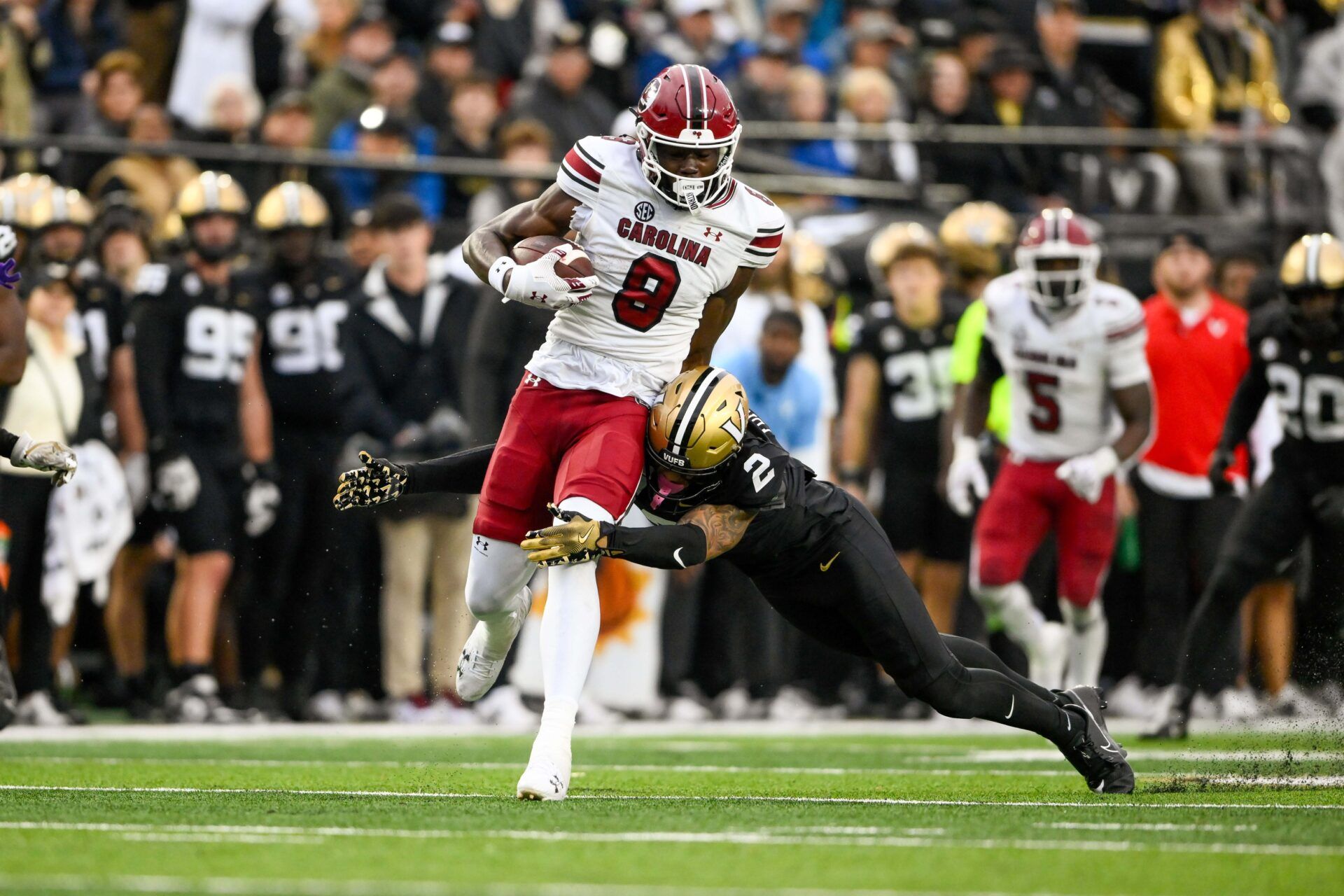 South Carolina Gamecocks wide receiver Nyck Harbor (8) breaks the tackle of Vanderbilt Commodores linebacker Randon Fontenette (2) during the first half at FirstBank Stadium.
