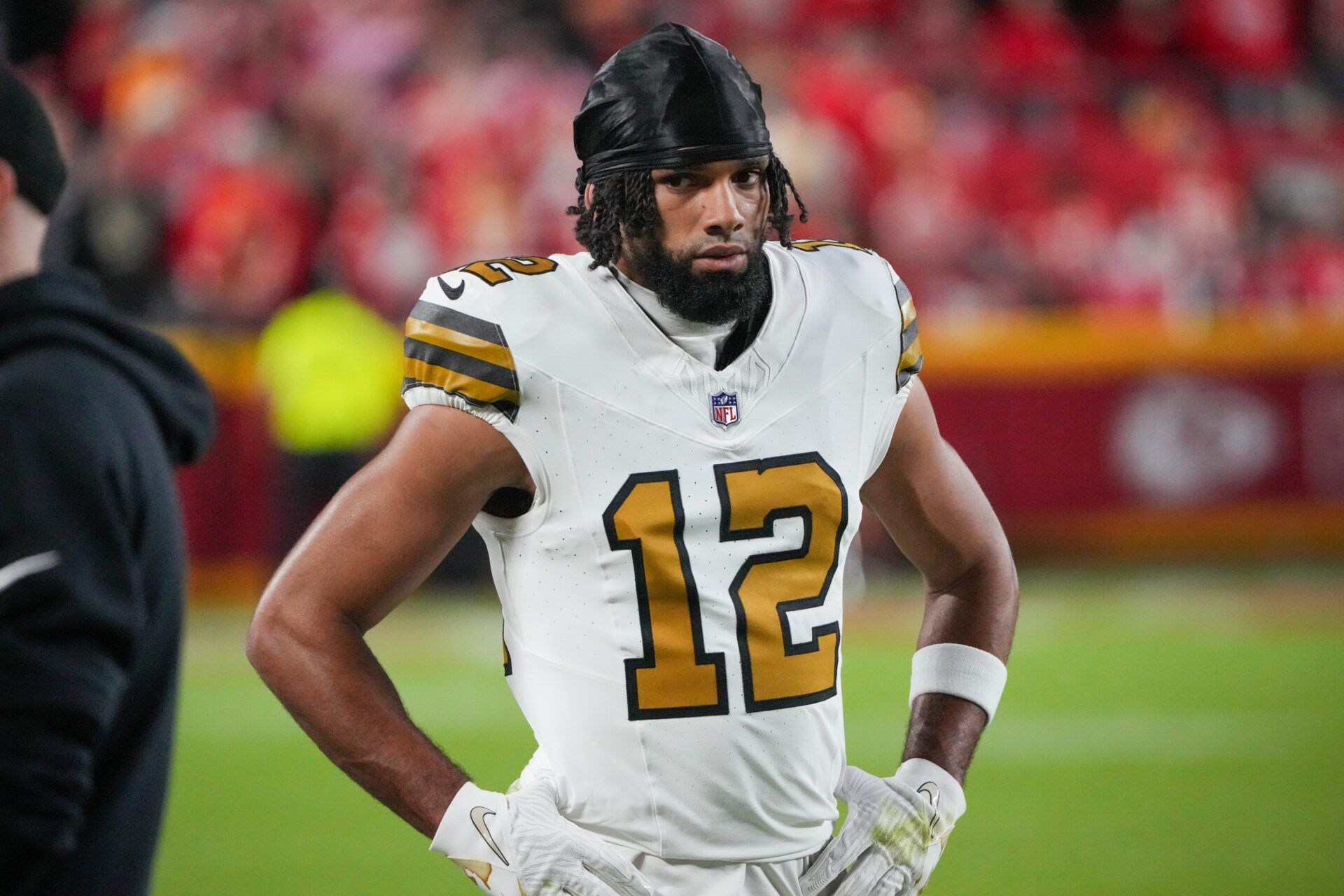 New Orleans Saints wide receiver Chris Olave (12) on the sidelines against the Kansas City Chiefs during the game at GEHA Field at Arrowhead Stadium.