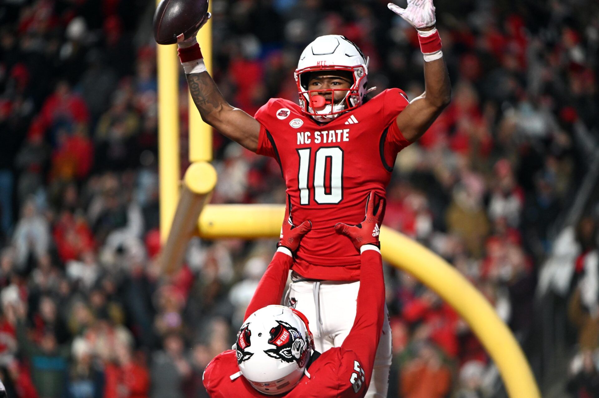 North Carolina State Wolfpack receiver KC Concepcion (10) celebrates after a touchdown against the North Carolina Tar Heels during the first half at Carter-Finley Stadium.