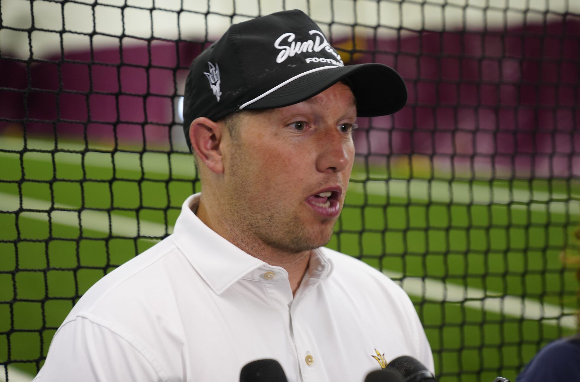 ASU head coach Kenny Dillingham talks with the press during an ASU annual kids football camp inside the Verde Dickey Dome in Tempe, Ariz. on June 11, 2025.