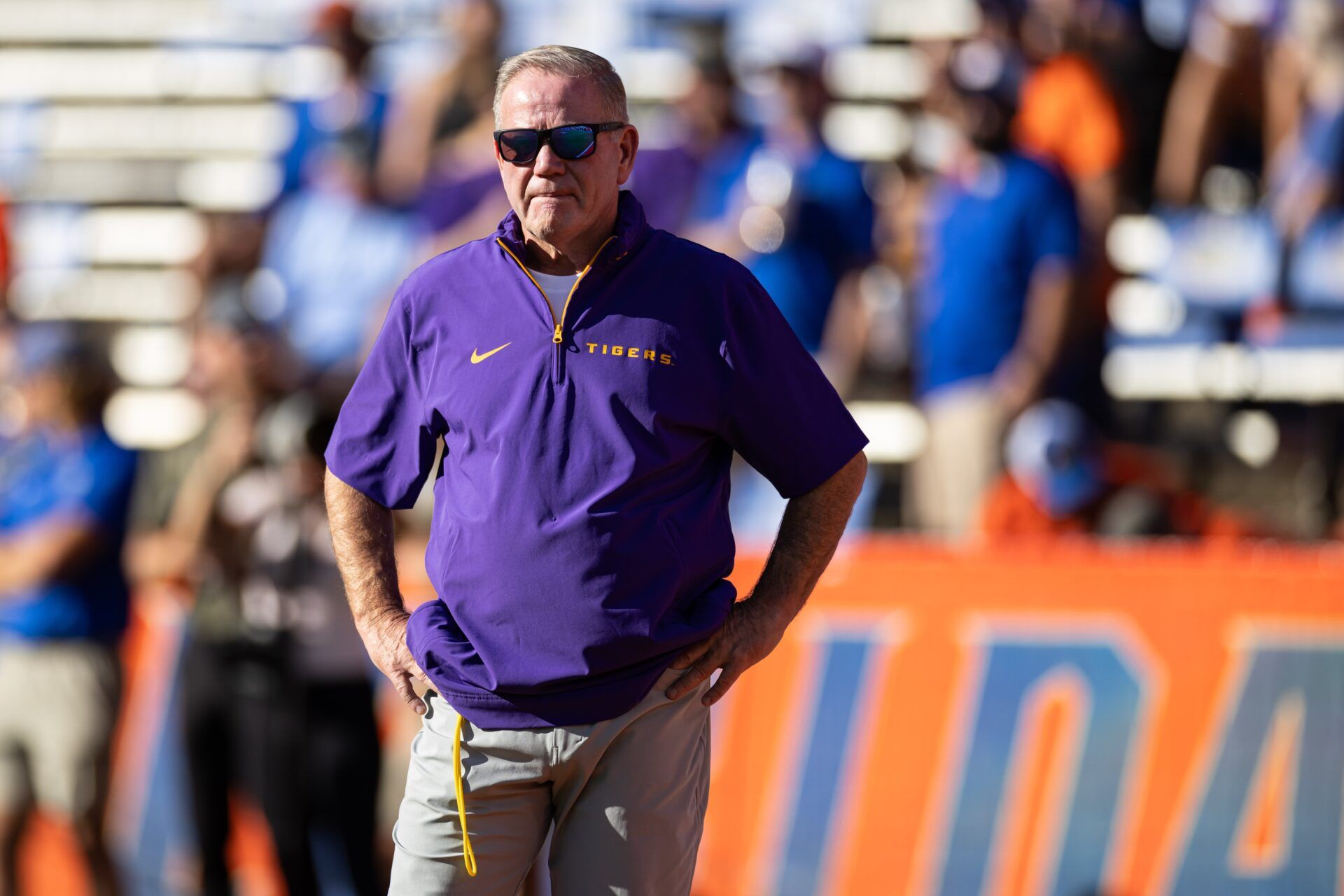 LSU Tigers head coach Brian Kelly looks on before a game against the Florida Gators at Ben Hill Griffin Stadium.