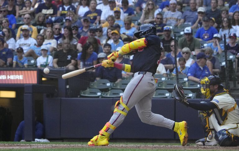 Atlanta Braves outfielder Ronald Acuna Jr. (13) gets a base hit against the Milwaukee Brewers in the eighth inning at American Family Field.