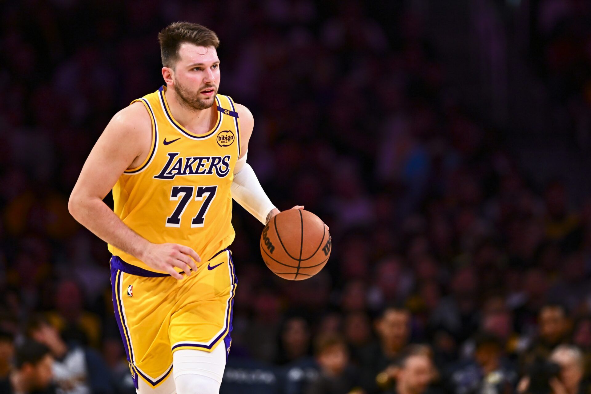 Los Angeles Lakers guard Luka Doncic (77) moves the ball against the Houston Rockets during the first half at Crypto.com Arena.