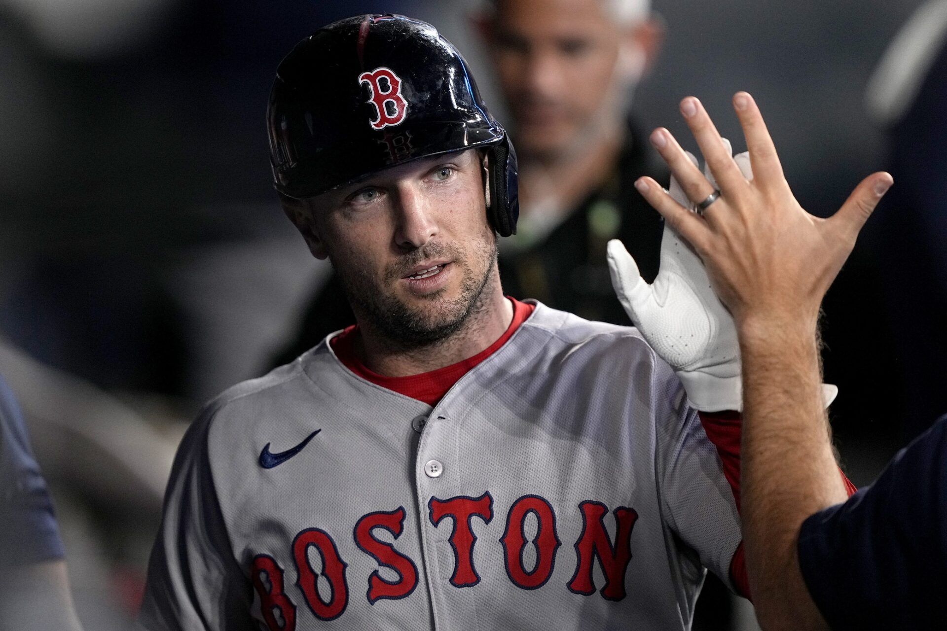 Boston Red Sox third baseman Alex Bregman (2) is congratulated after scoring against the Toronto Blue Jays during the ninth inning at Rogers Centre.