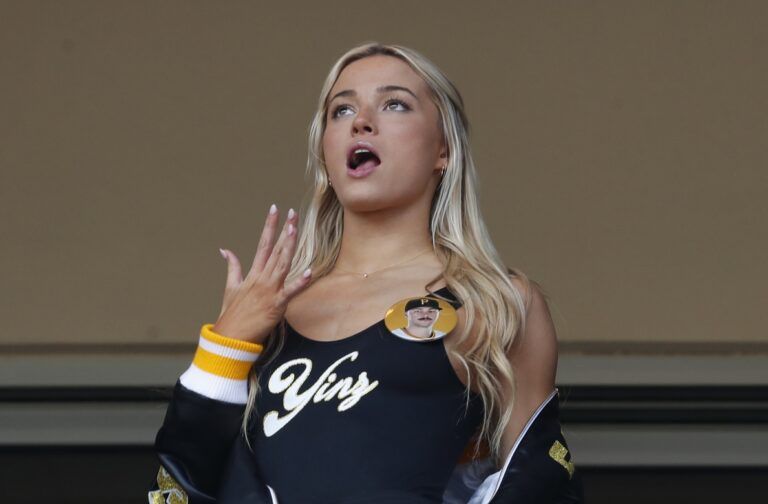 Louisiana State University gymnast Olivia Dunn (middle) reacts as her boyfriend Pittsburgh Pirates starting pitcher Paul Skenes (not pictured) pitches in his major league debut against the Chicago Cubs during the fourth inning at PNC Park.