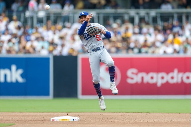 Los Angeles Dodgers shortstop Mookie Betts (50) makes a throw to first base for an out during the fifth inning against the San Diego Padres at Petco Park.