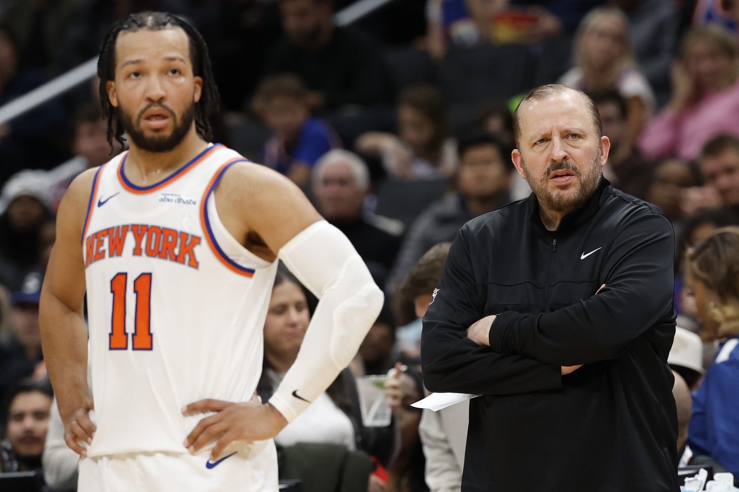 New York Knicks head coach Tom Thibodeau (R) and Knicks guard Jalen Brunson (11) look on during a stoppage in play against the Washington Wizards in the third quarterat Capital One Arena.