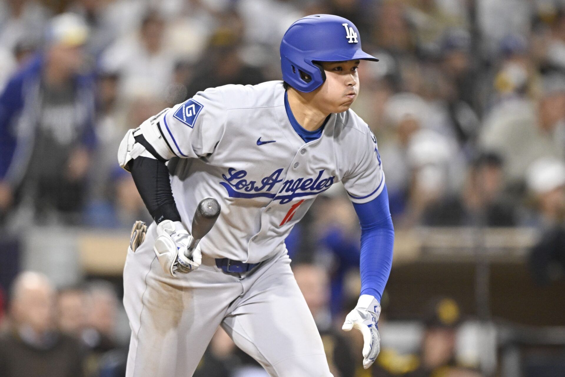 Los Angeles Dodgers designated hitter Shohei Ohtani (17) hits a single during the fifth inning against the San Diego Padres at Petco Park.
