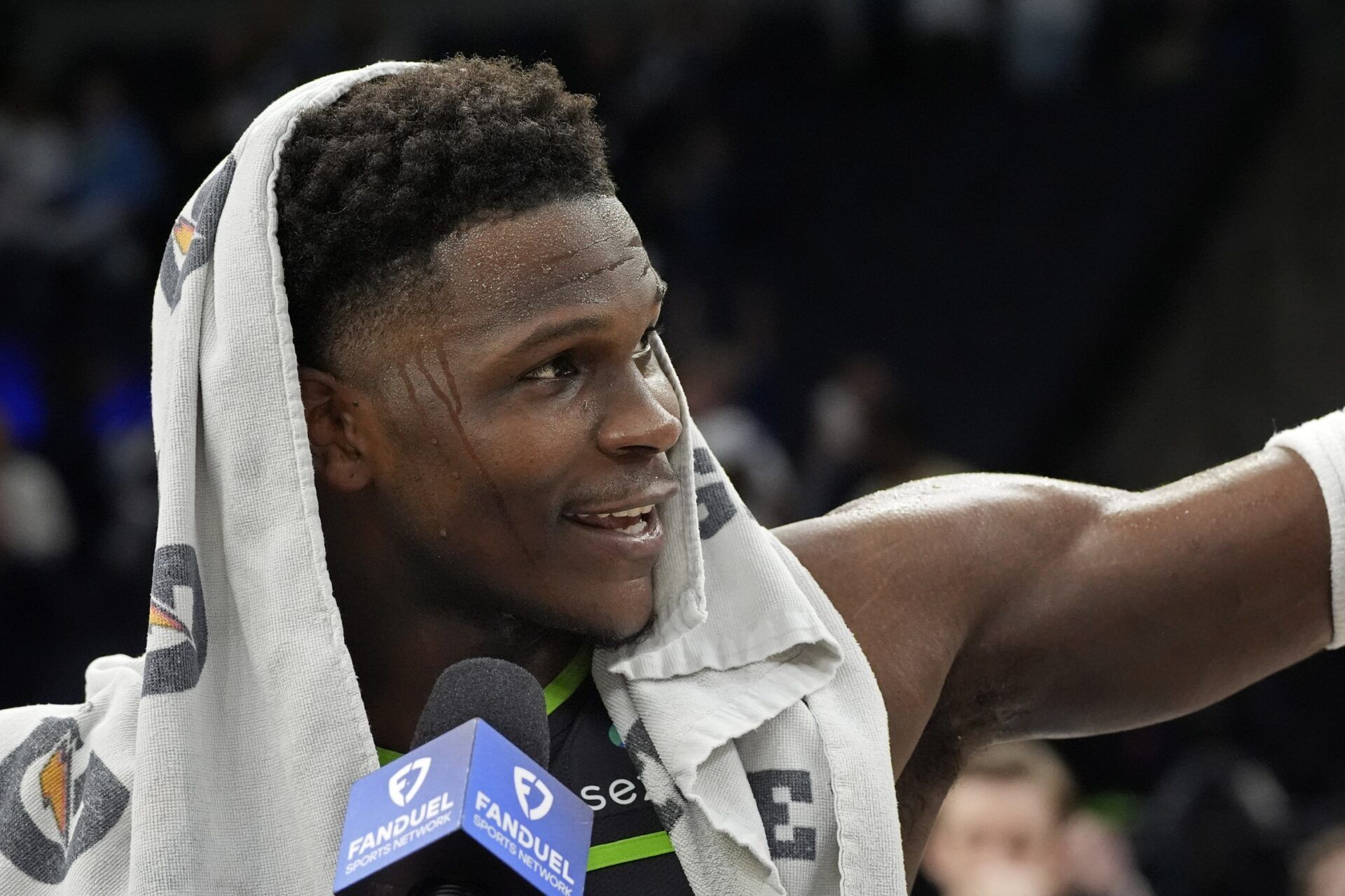 Minnesota Timberwolves guard Anthony Edwards (5) thanks the fans during an interview after a game against the Orlando Magic at Target Center.
