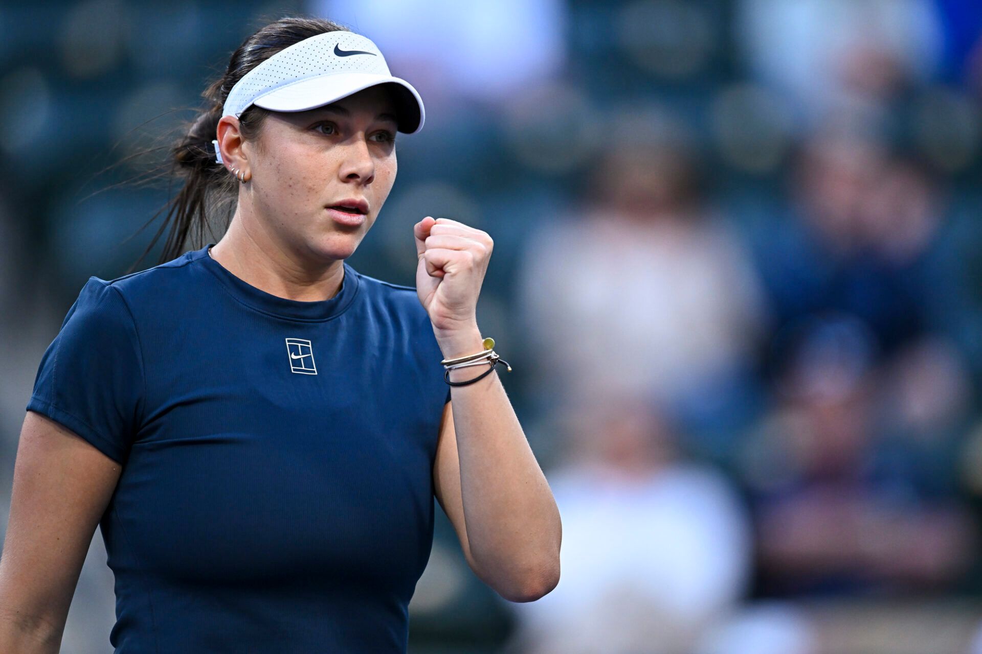 Amanda Anisimova (USA) reacts after winning a point against Belinda Bencic (SUI) at Indian Well Tennis Garden.